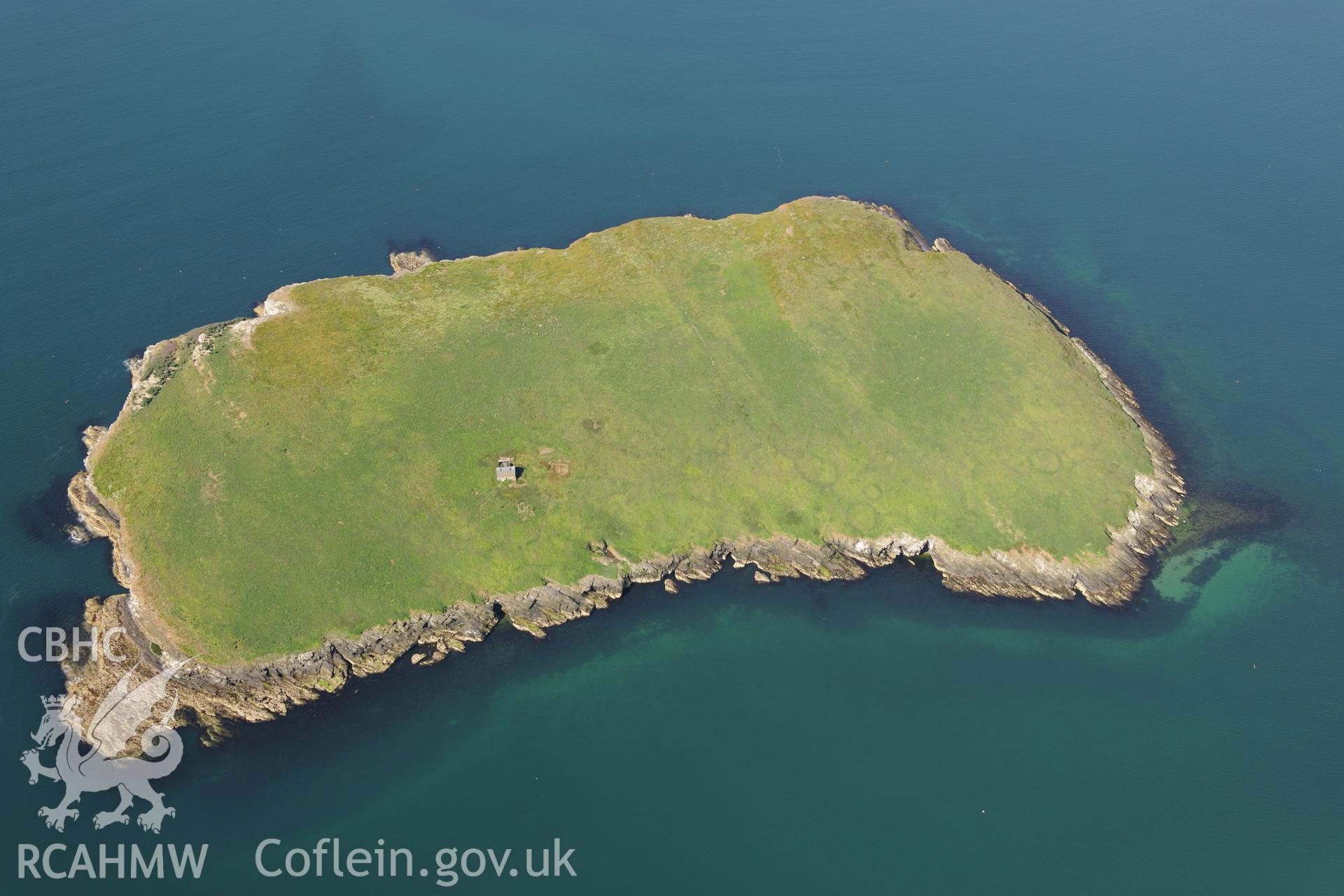 The chapel building, the footings of a priory hall and the fish trap at St. Tudwal's Island East. Oblique aerial photograph taken during the Royal Commission's programme of archaeological aerial reconnaissance by Toby Driver on 23rd June 2015.