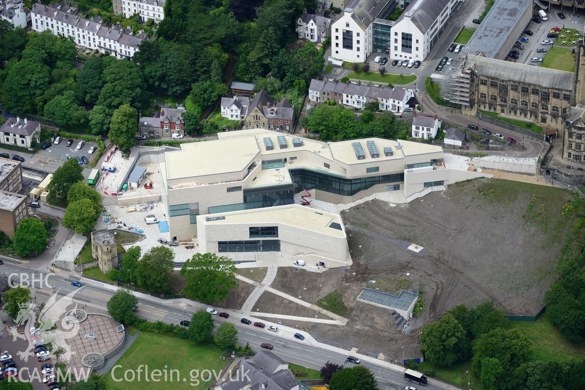 Bangor University, Theatr Gwynedd(demolished),Pontio, town hall, library, medieval church site & war memorial. Oblique aerial photograph taken during the Royal Commission's programme of archaeological aerial reconnaissance by Toby Driver on 30th July 2015.