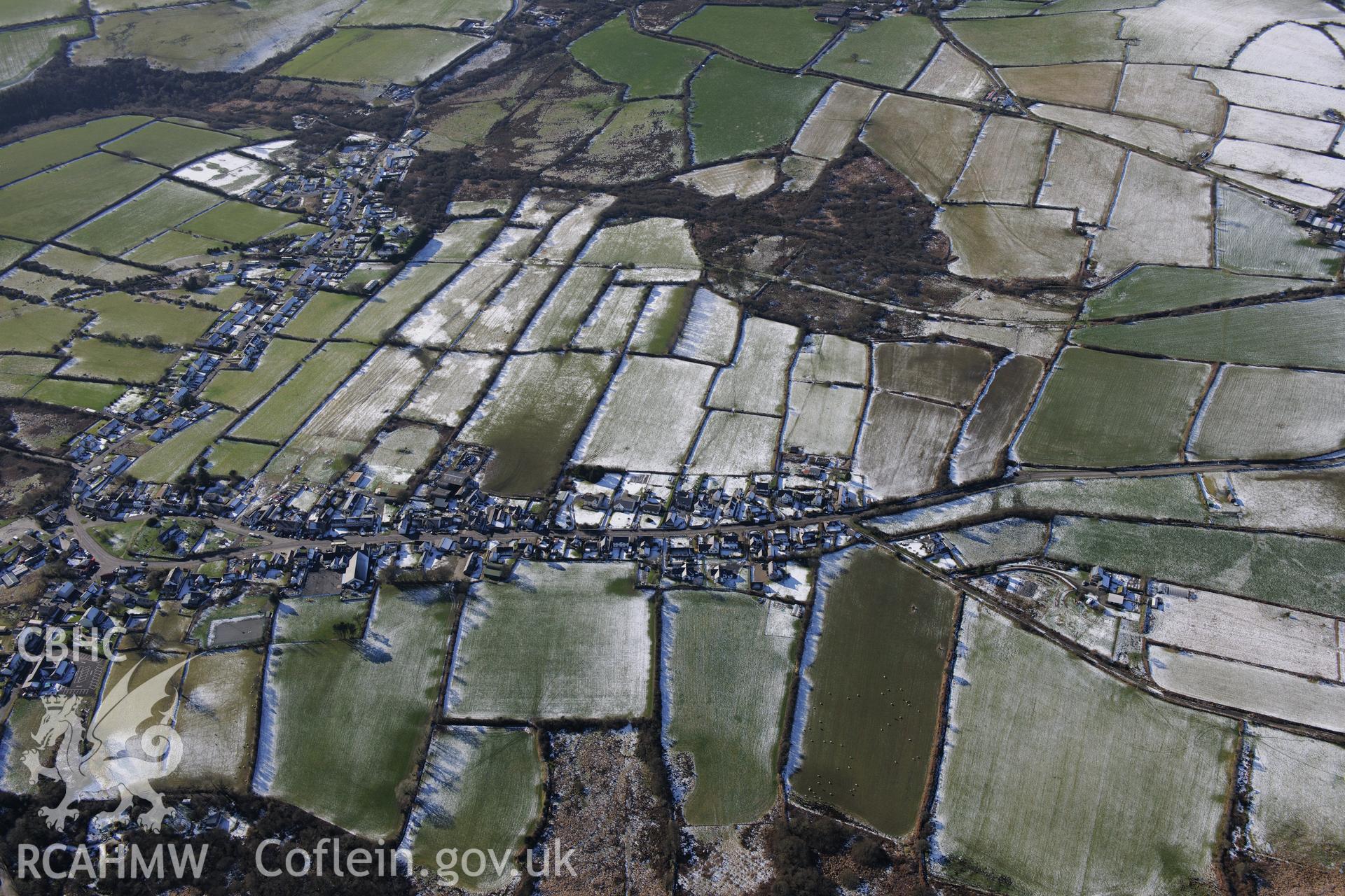View of the village of Maenclochog from the east. Oblique aerial photograph taken during the Royal Commission's programme of archaeological aerial reconnaissance by Toby Driver on 4th February 2015.