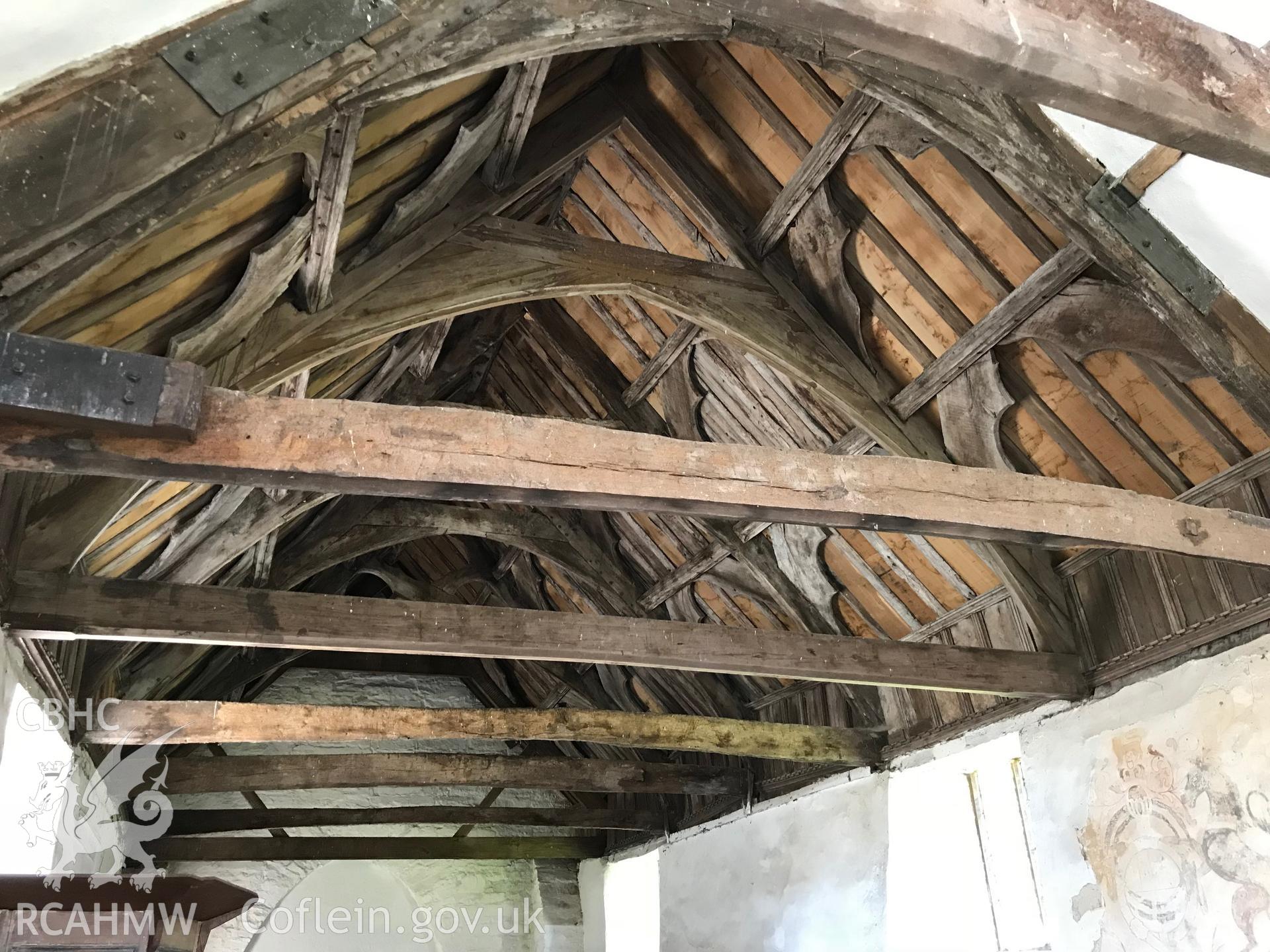 Colour photo showing interior view of the roof and a wall painting at St. Cewydd's Church, Diserth, taken by Paul R. Davis, 19th May 2018.