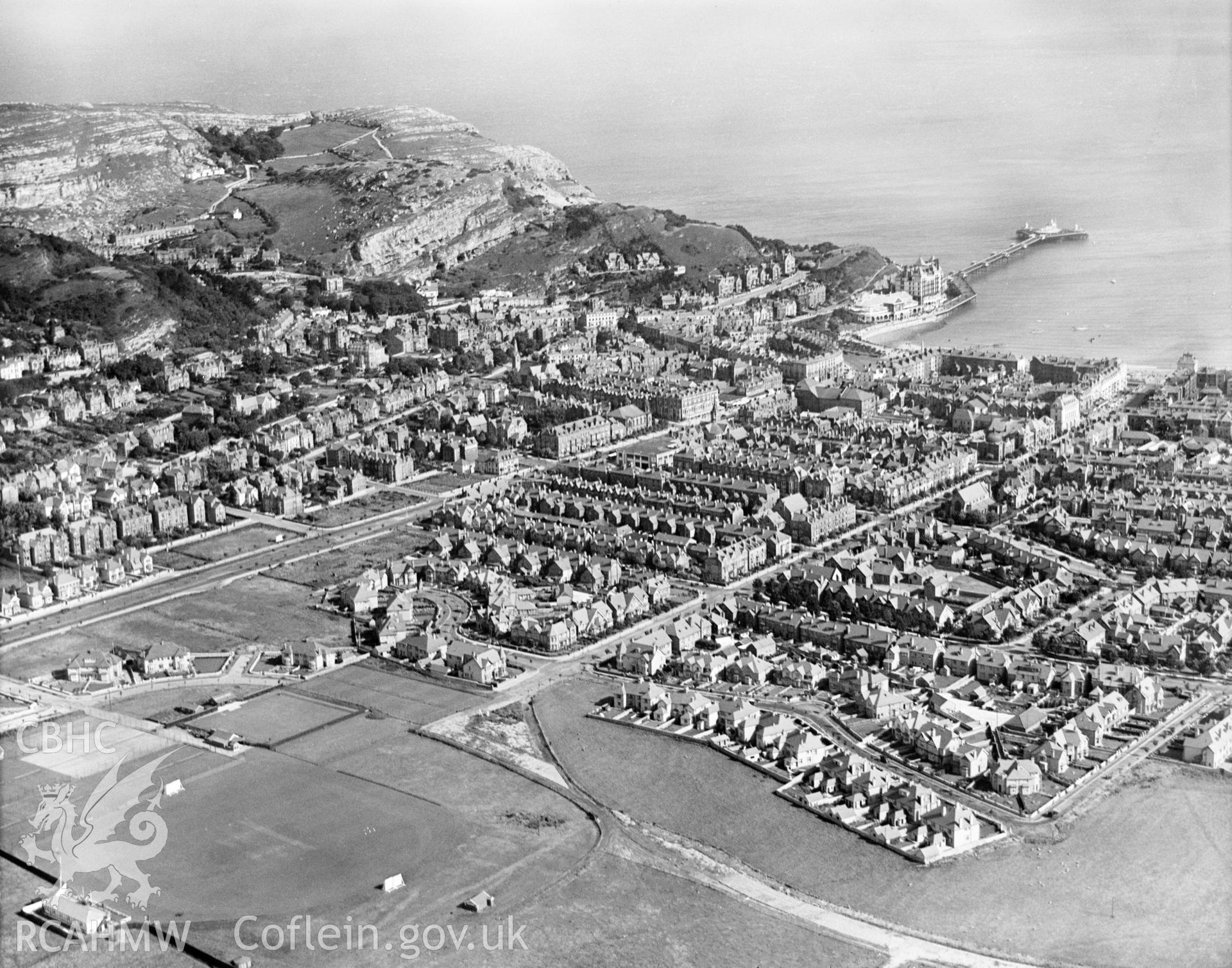 General view of Llandudno, showing cricket and tennis grounds, oblique aerial view. 5?x4? black and white glass plate negative.
