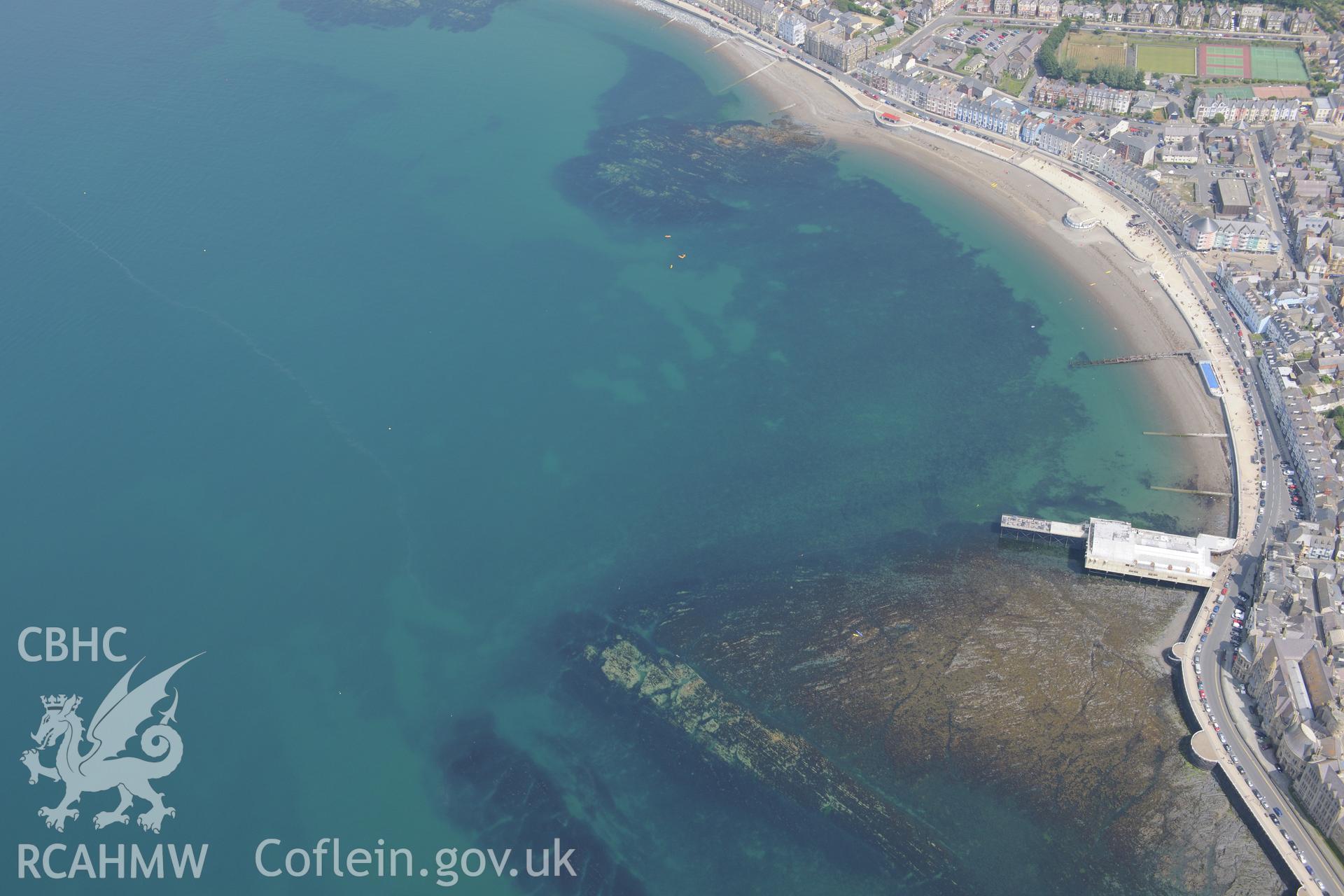 The Royal Pier and Pavilion and the promenade at Aberystwyth. Oblique aerial photograph taken during the Royal Commission?s programme of archaeological aerial reconnaissance by Toby Driver on 12th July 2013.