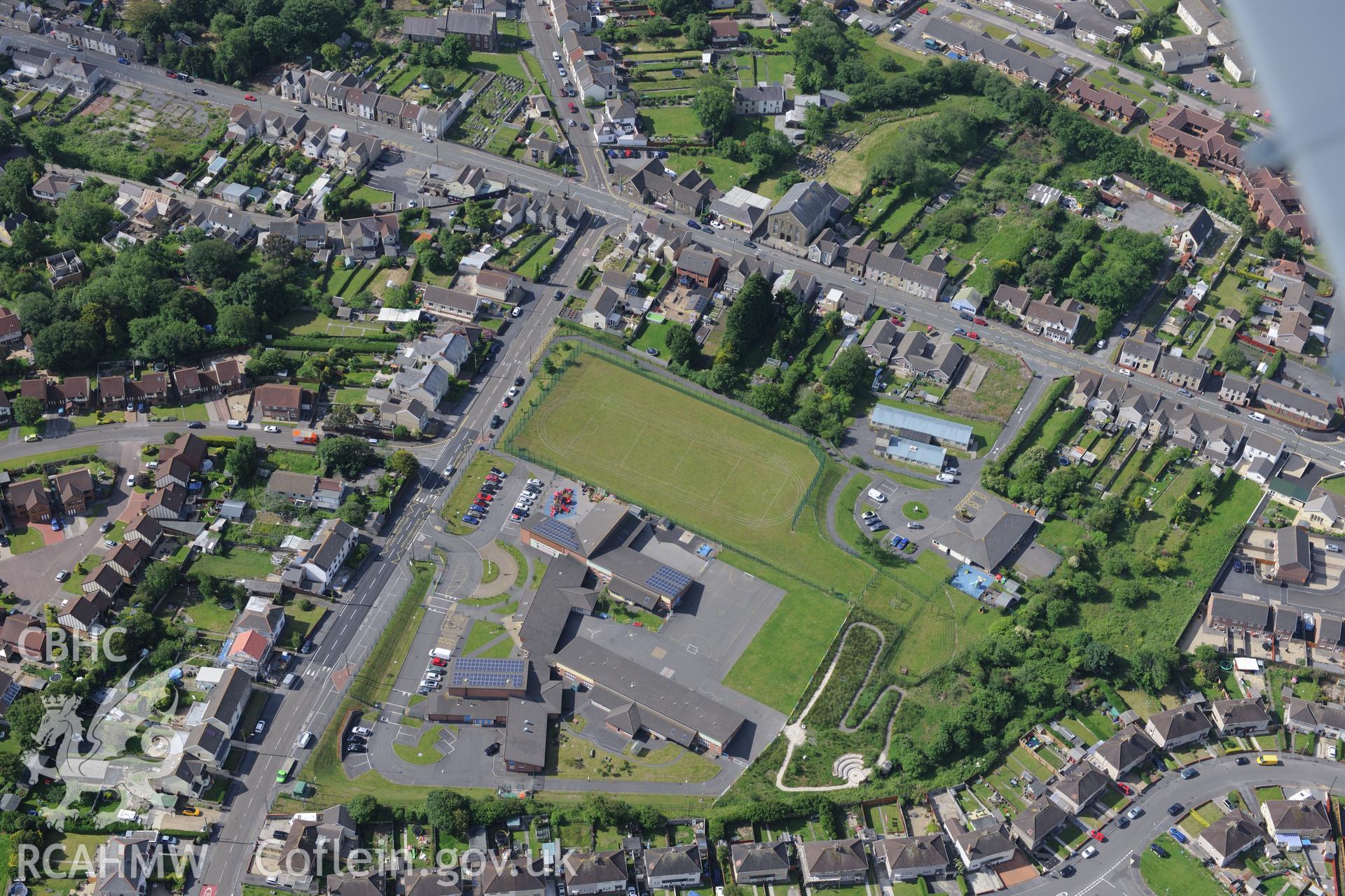 Brynteg Primary School and Tabernacl Welsh Baptist Church, Llwynhendy, Llanelli. Oblique aerial photograph taken during the Royal Commission's programme of archaeological aerial reconnaissance by Toby Driver on 19th June 2015.
