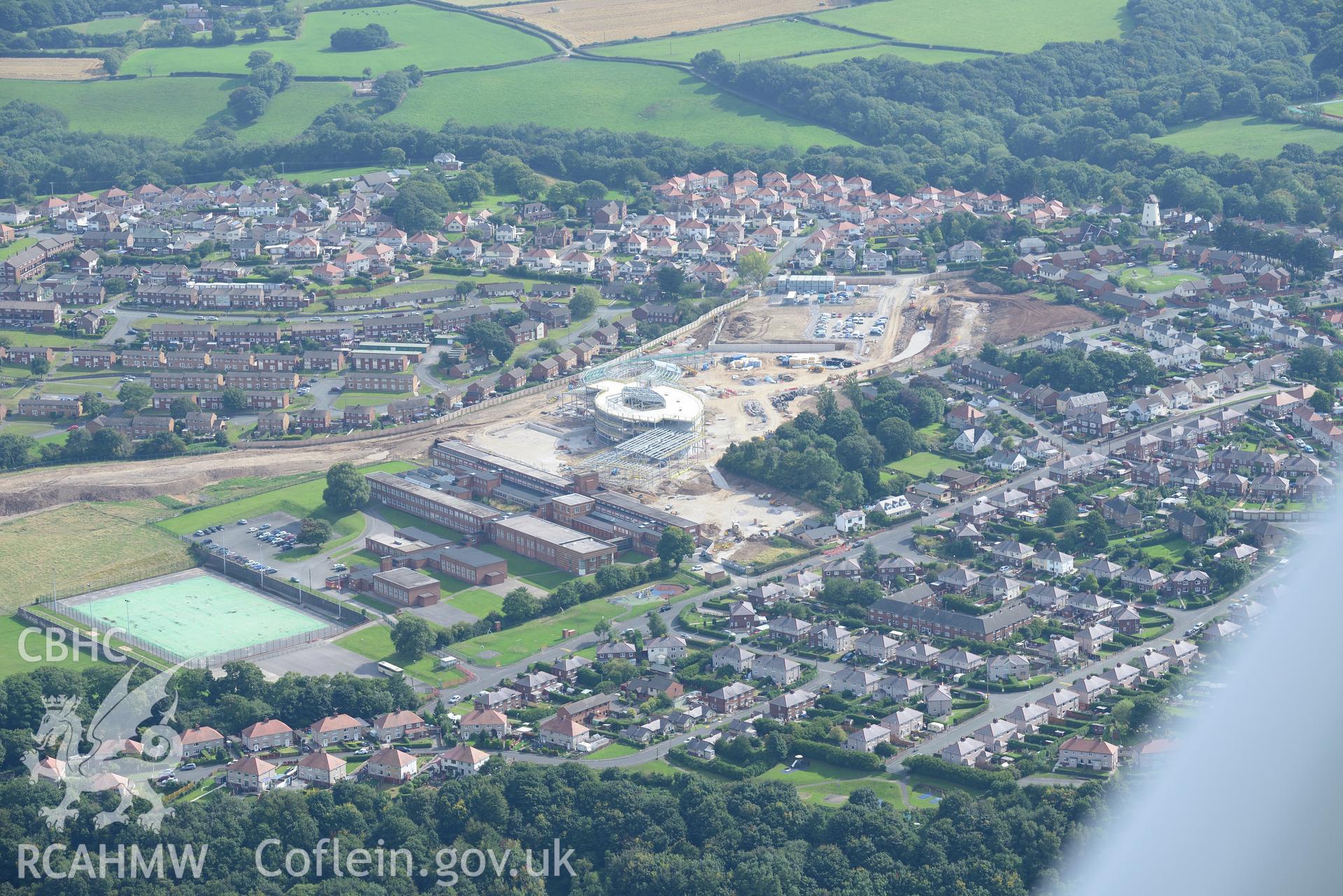 Holywell, including the old High School, with Ysgol Treffynon and Ysgol Maes y Felin under construction behind. Oblique aerial photograph taken during the Royal Commission's programme of archaeological aerial reconnaissance by Toby Driver on 11/09/2015.