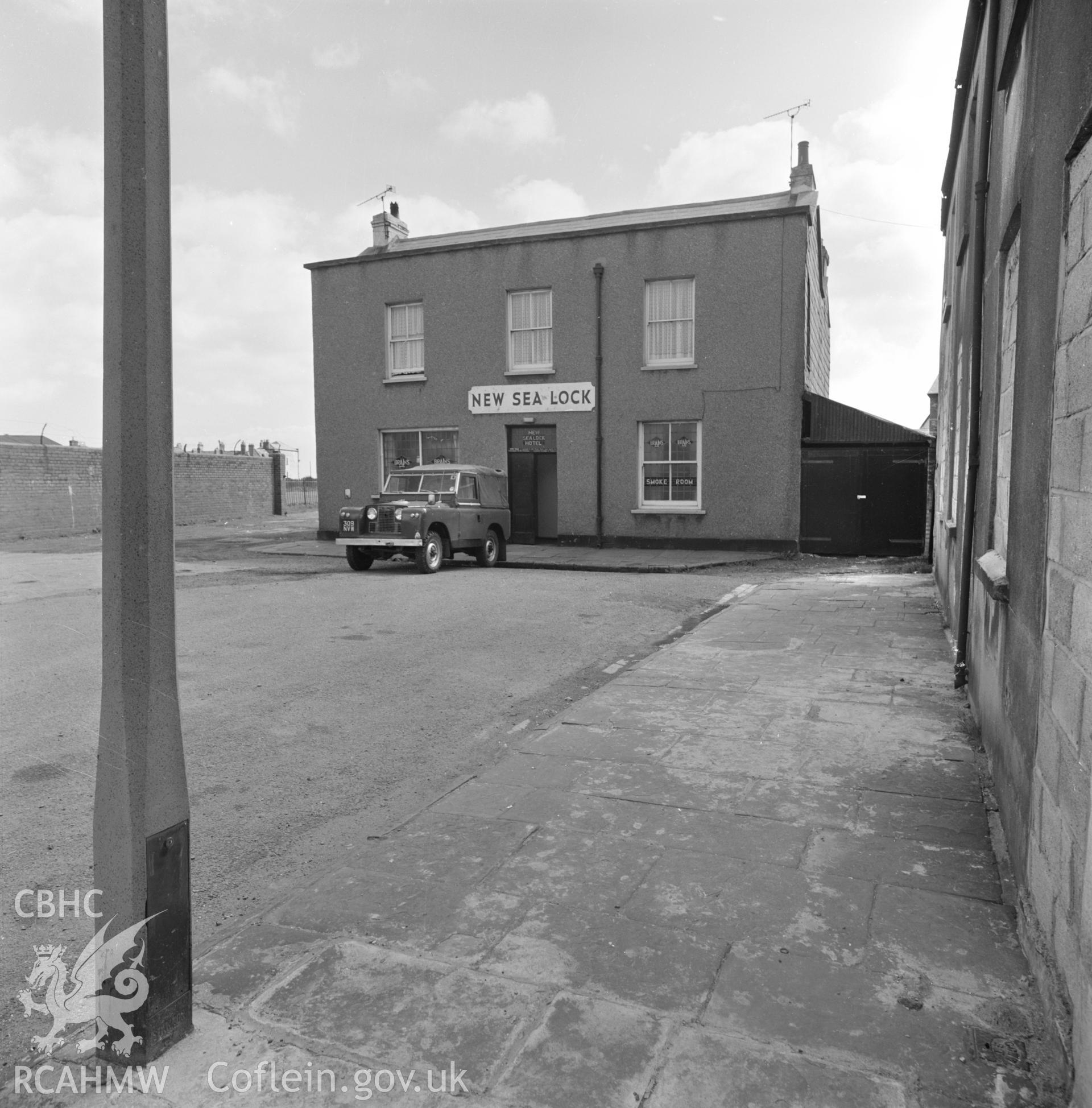 Digital copy of a black and white negative showing New Sea Lock Hotel, Cardiff.