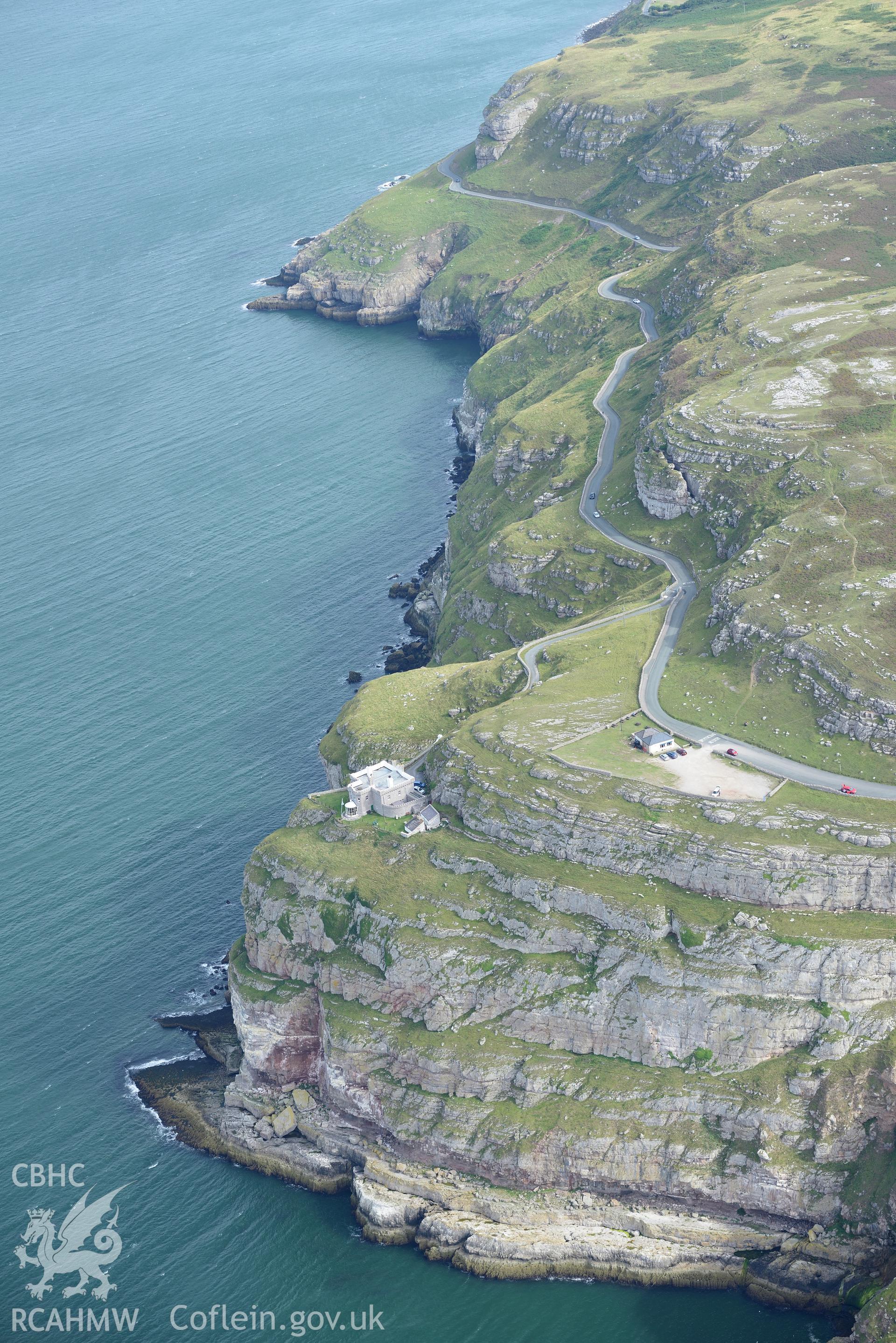 Great Orme's Head lighthouse. Oblique aerial photograph taken during the Royal Commission's programme of archaeological aerial reconnaissance by Toby Driver on 11th September 2015.