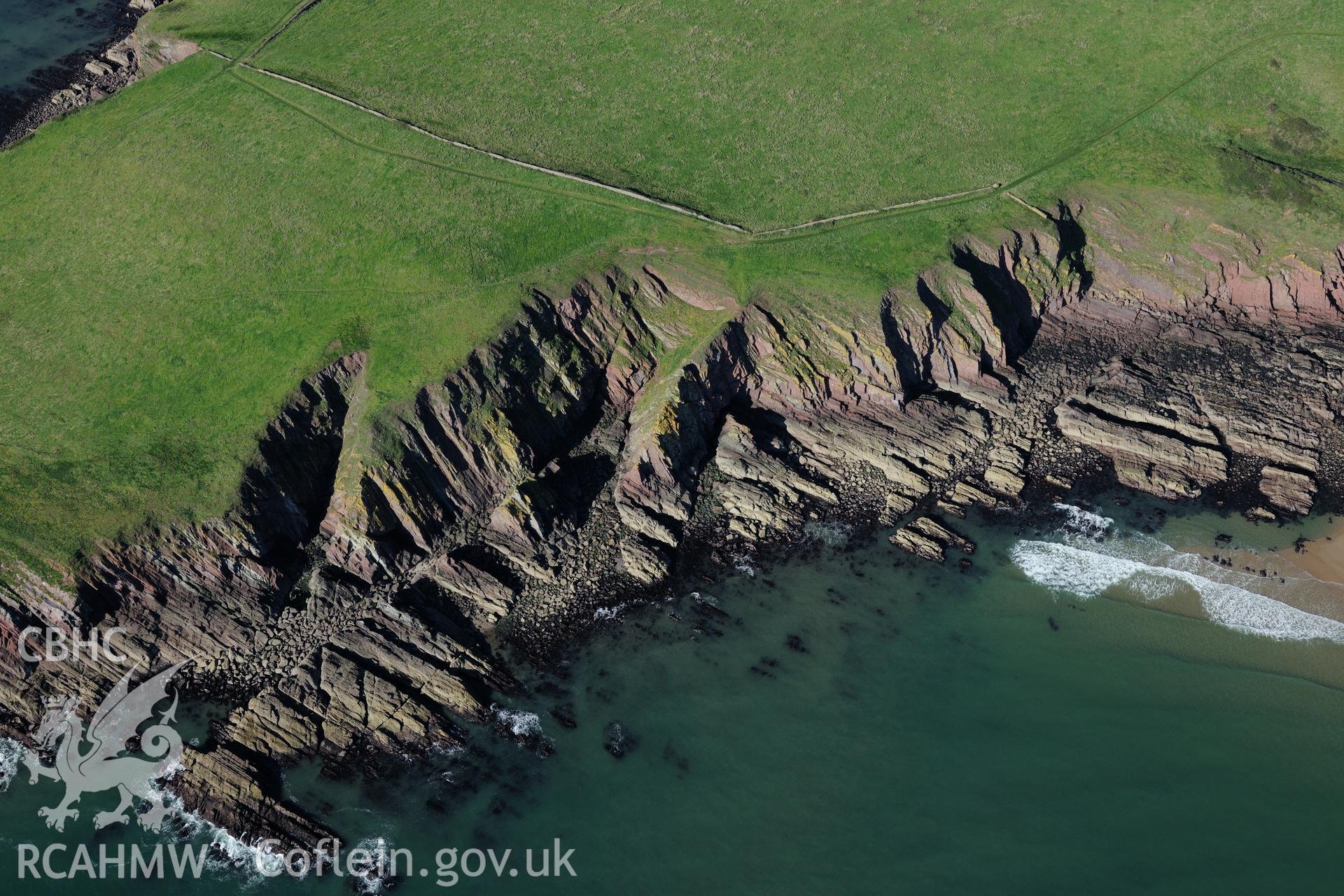 Giltar Spit on south western side of Caldey Island, about two miles off the south western coast of Tenby. Oblique aerial photograph taken during the Royal Commission's programme of archaeological aerial reconnaissance by Toby Driver on 30th September 2015.