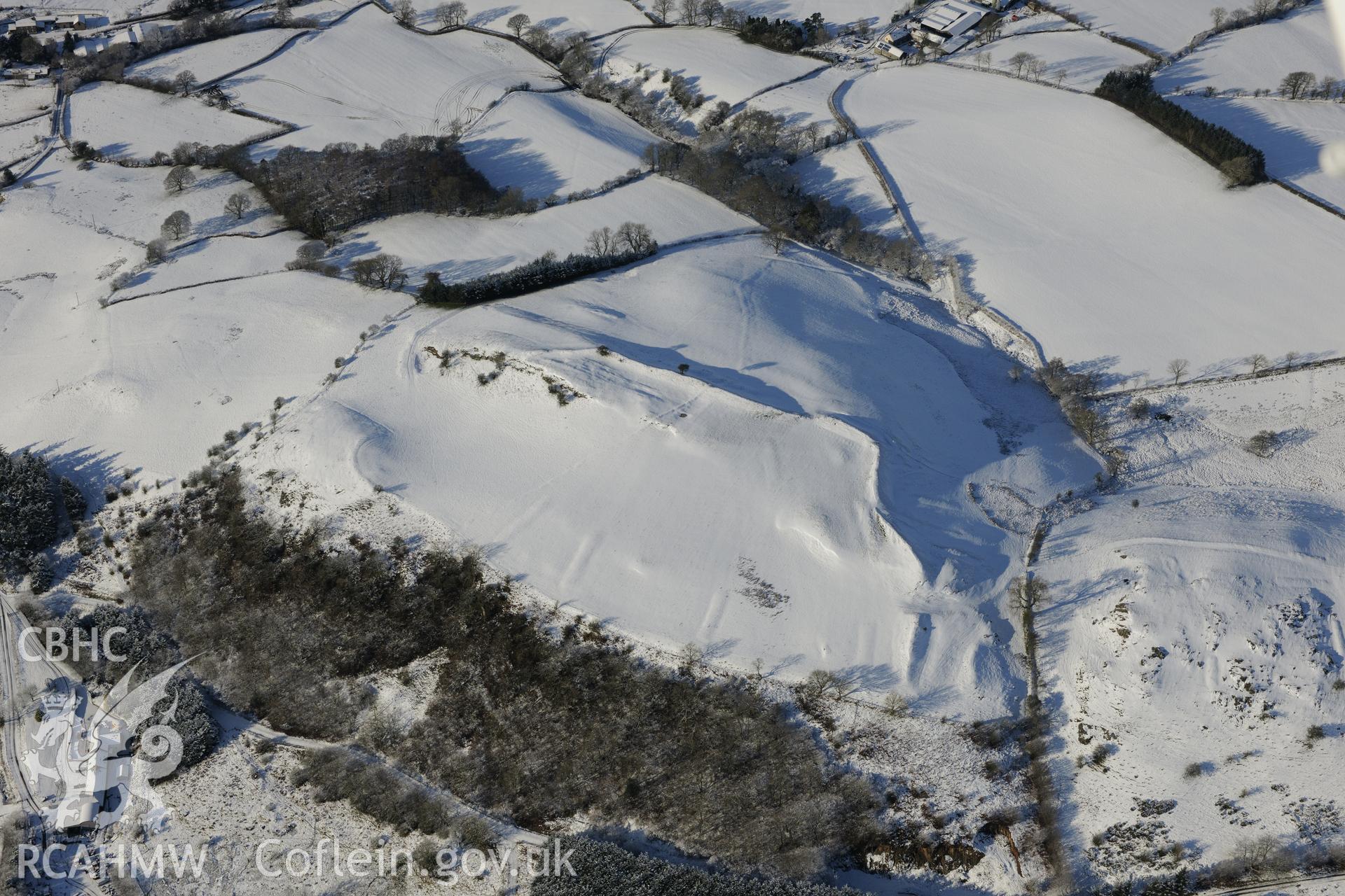 Graig farmstead and Graig Fawr camp, Glaswcwm, south east of Llandrindod Wells. Oblique aerial photograph taken during the Royal Commission?s programme of archaeological aerial reconnaissance by Toby Driver on 15th January 2013.