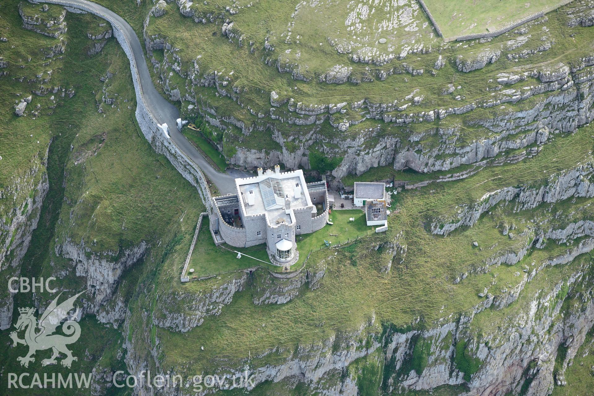 Great Orme's Head lighthouse. Oblique aerial photograph taken during the Royal Commission's programme of archaeological aerial reconnaissance by Toby Driver on 11th September 2015.