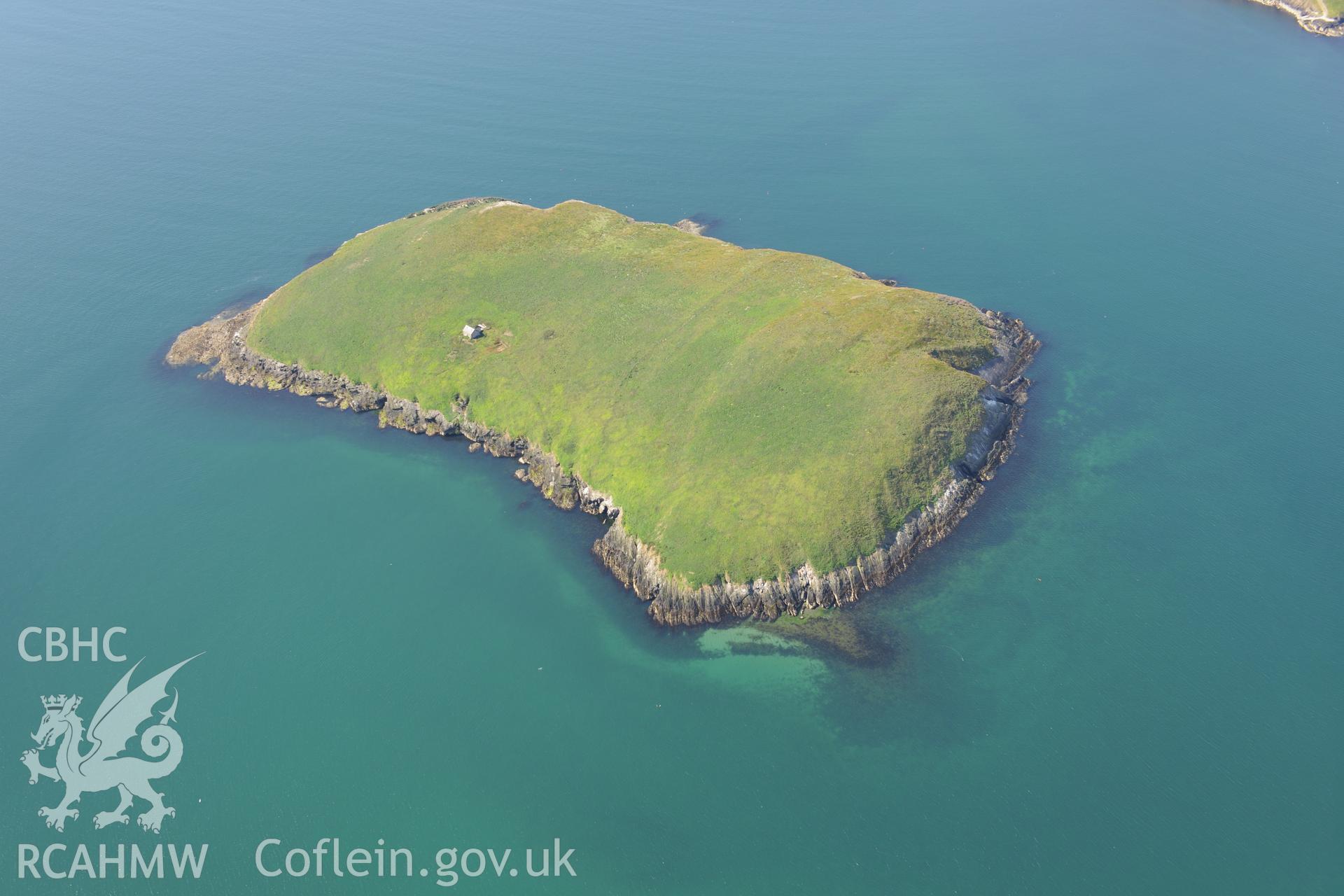 Chapel buildings; footings of priory hall and fish trap at St Tudwal's Island (east). Oblique aerial photograph taken during the Royal Commission's programme of archaeological aerial reconnaissance by Toby Driver on 23rd June 2015.