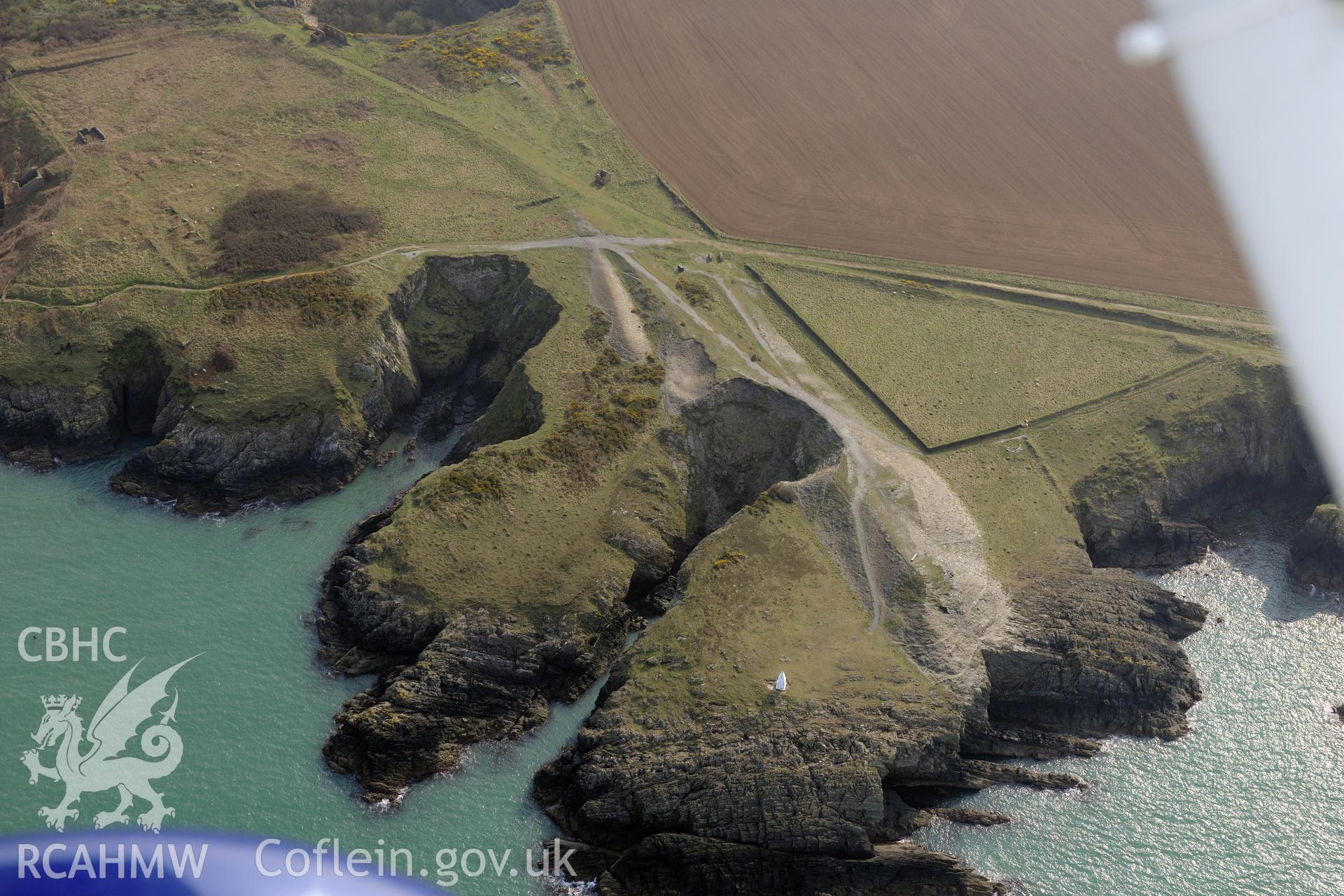 Royal Commission aerial photograph of Porthgain quarries taken on 27th March 2017. Baseline aerial reconnaissance survey for the CHERISH Project. ? Crown: CHERISH PROJECT 2017. Produced with EU funds through the Ireland Wales Co-operation Programme 2014-2020. All material made freely available through the Open Government Licence.