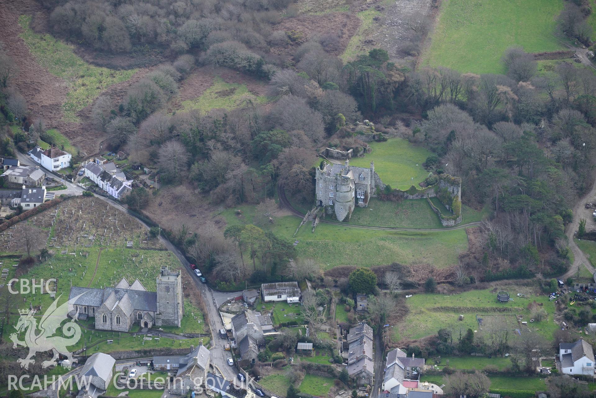 Newport Castle and St. Mary's church, Newport, Pembrokeshire. Oblique aerial photograph taken during the Royal Commission's programme of archaeological aerial reconnaissance by Toby Driver on 13th March 2015.