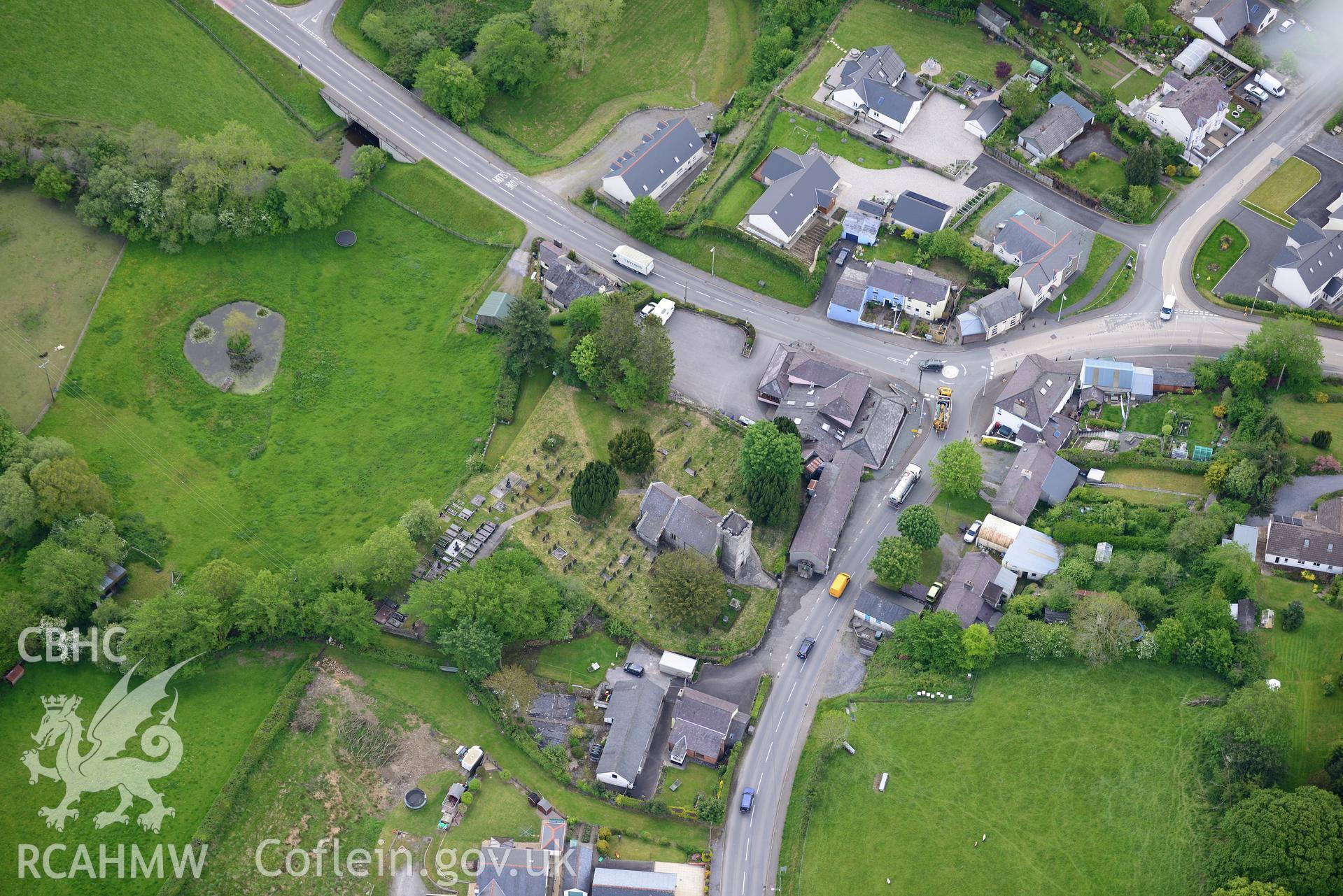 St. Gwynin's Church and Llanwnnen Village. Oblique aerial photograph taken during the Royal Commission's programme of archaeological aerial reconnaissance by Toby Driver on 3rd June 2015.