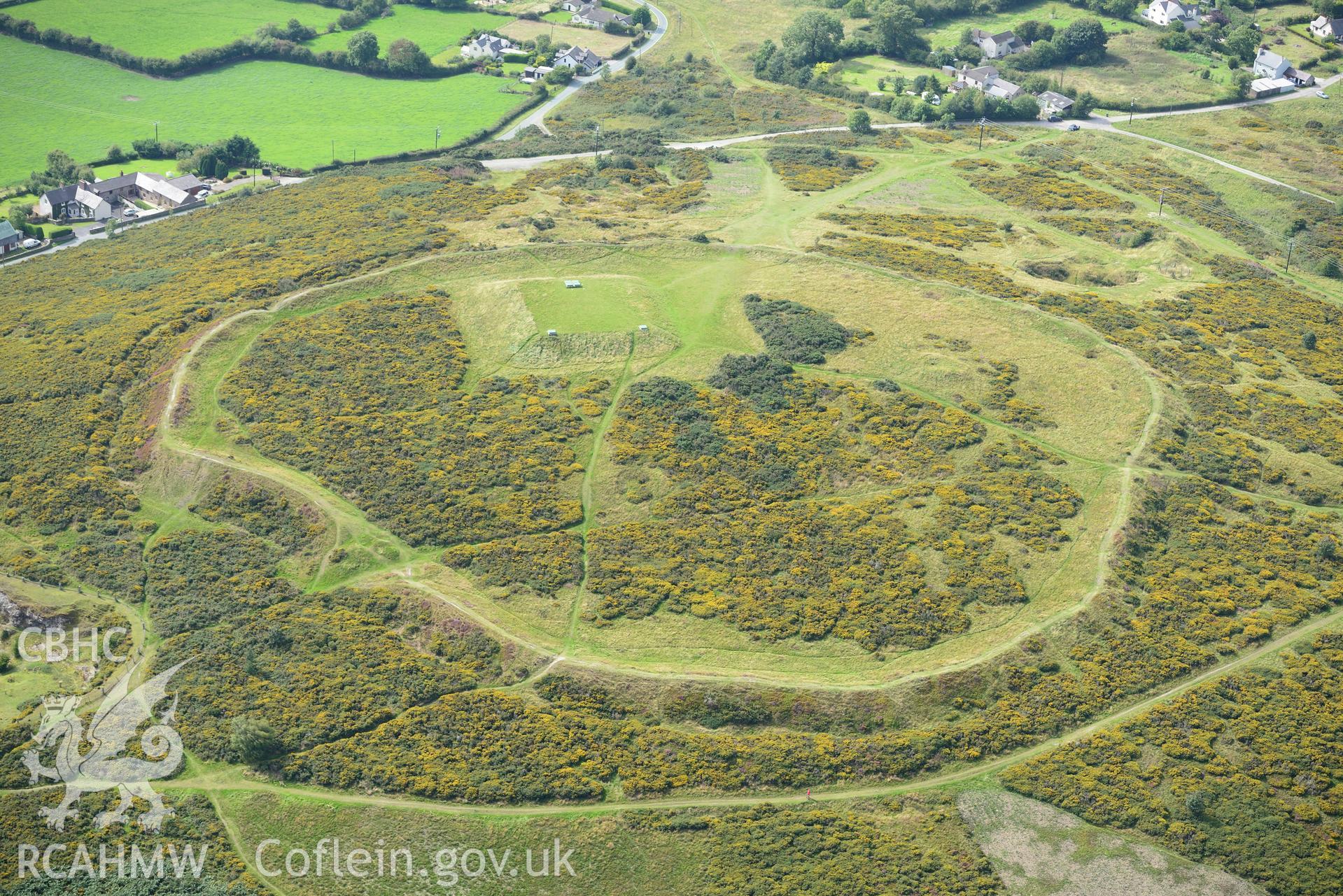 Moel-y-Gaer camp or hill top enclosure, Halkyn. Oblique aerial photograph taken during the Royal Commission's programme of archaeological aerial reconnaissance by Toby Driver on 11th September 2015.