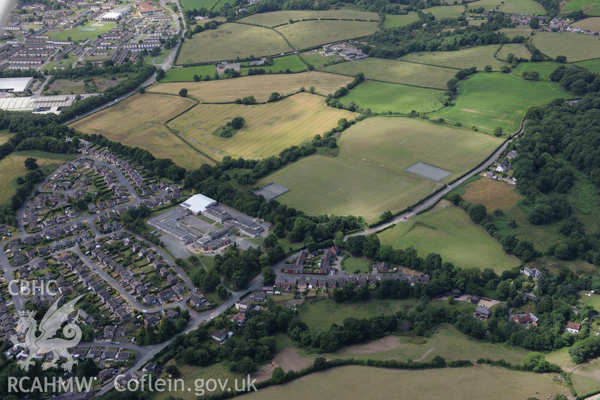 Rhiwabon town and the Tatham Bridge section of Offa's Dyke. Oblique aerial photograph taken during the Royal Commission's programme of archaeological aerial reconnaissance by Toby Driver on 30th July 2015.