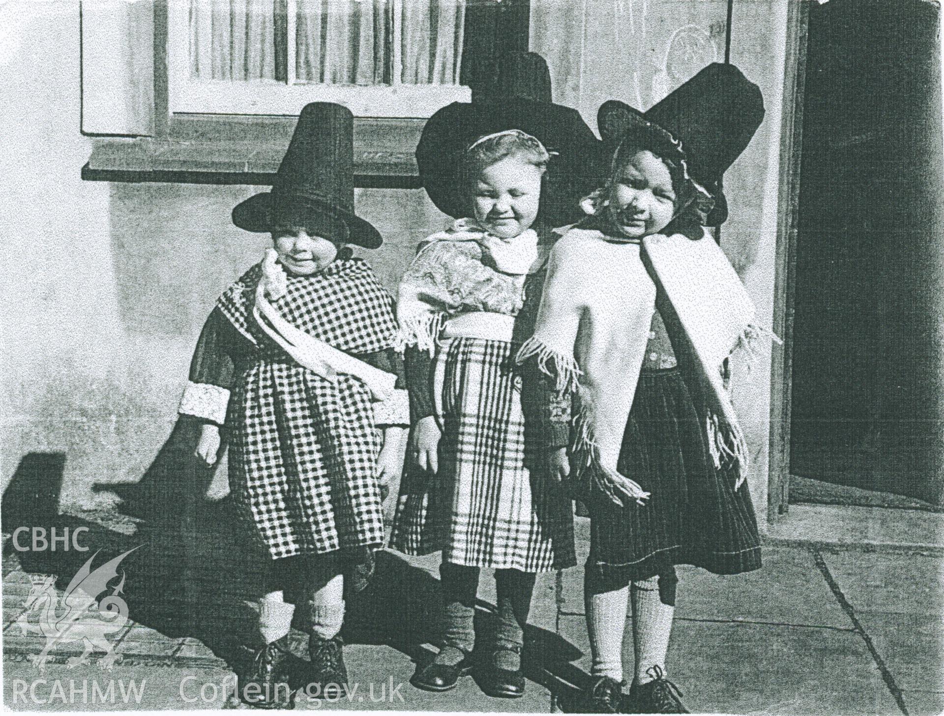 Black and white photograph of three girls in Welsh costume at first Welsh school in Maesteg, circa 1953. Donated to the RCAHMW by Cyril Philips as part of the Digital Dissent Project.