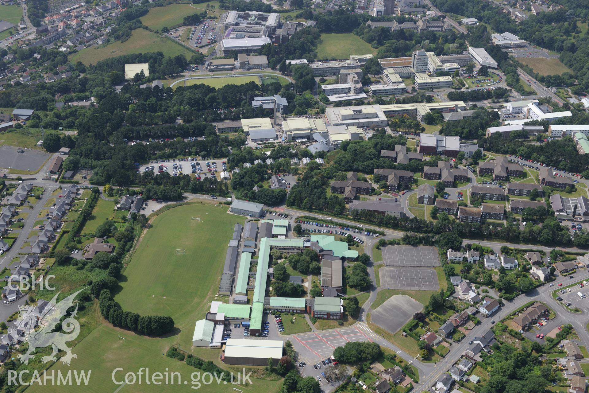 Penglais Comprehensive School and Aberystwyth University, Aberystwyth. Oblique aerial photograph taken during the Royal Commission?s programme of archaeological aerial reconnaissance by Toby Driver on 12th July 2013.