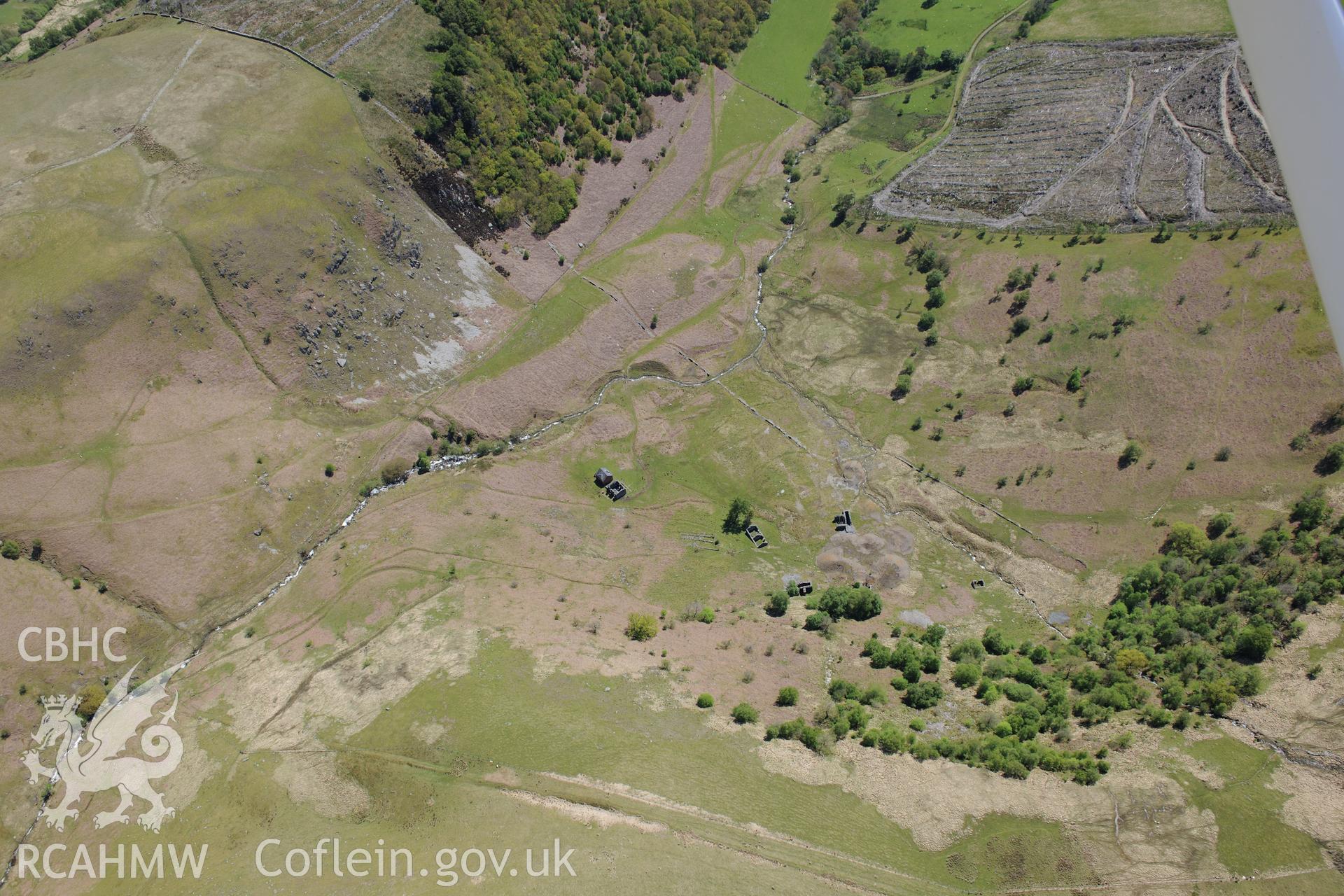 Cwm Elan lead mine complex, including the remains of a house, office, quarry, mine shaft and wheel pit. Oblique aerial photograph taken during the Royal Commission's programme of archaeological aerial reconnaissance by Toby Driver on 3rd June 2015.