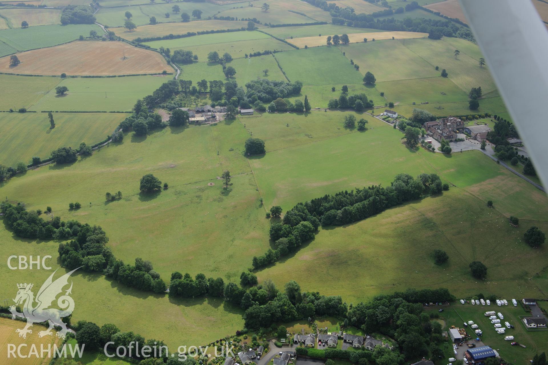 Grounds and gardens of Gwernyfed Park (including the former deer park); Gwernyfed Gaer defended enclosure, and Gwernyfed High School. Oblique aerial photograph taken during the Royal Commission?s programme of archaeological aerial reconnaissance by Toby Driver on 1st August 2013.