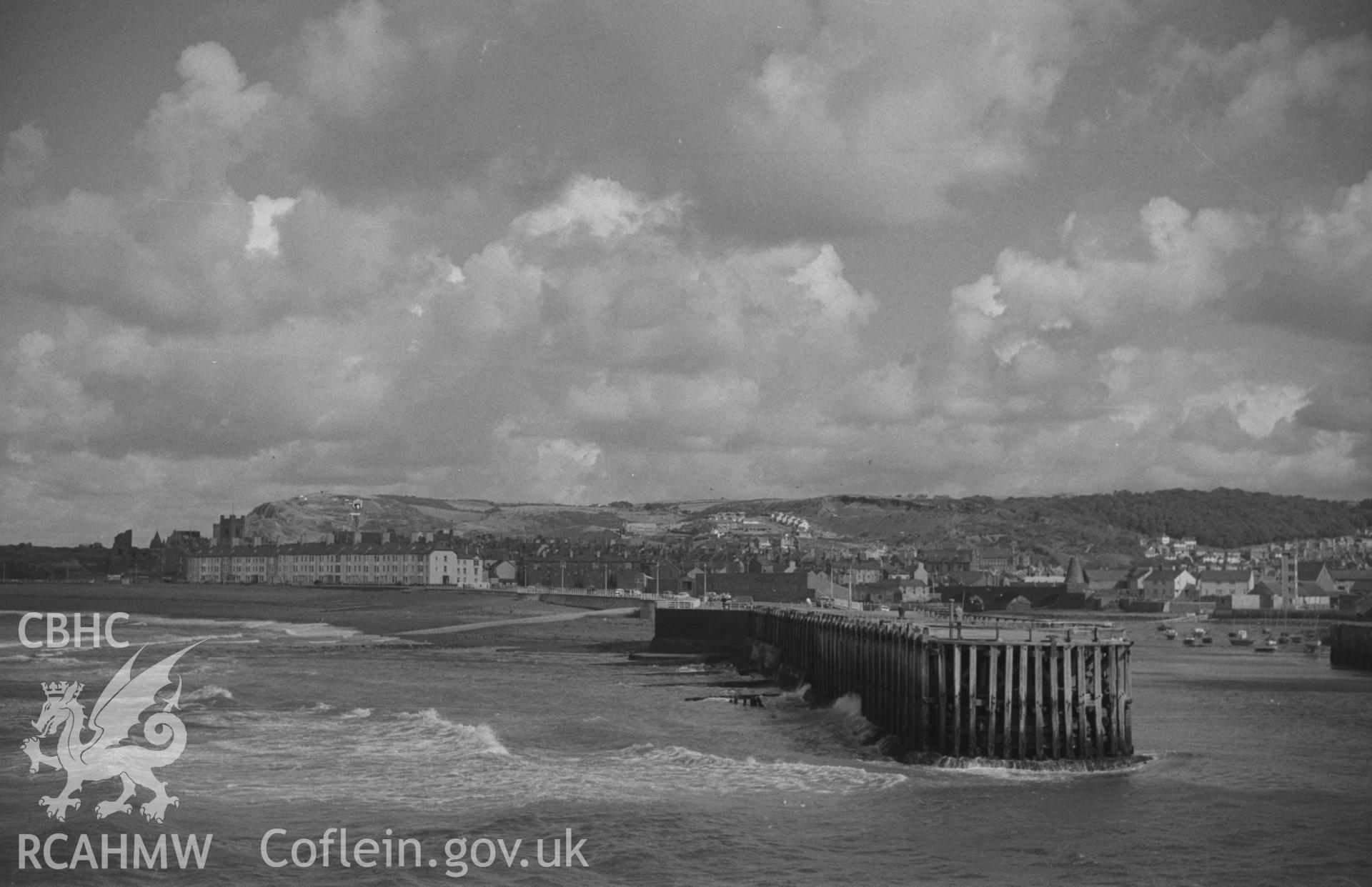 Digital copy of a black and white negative showing view of Aberystwyth jetty. Photographed by Arthur O. Chater in September 1964 from Tanybwlch pier, Aberystwyth. Grid Reference SN 5785 8078. (Panorama. Photograph 3 of 10).