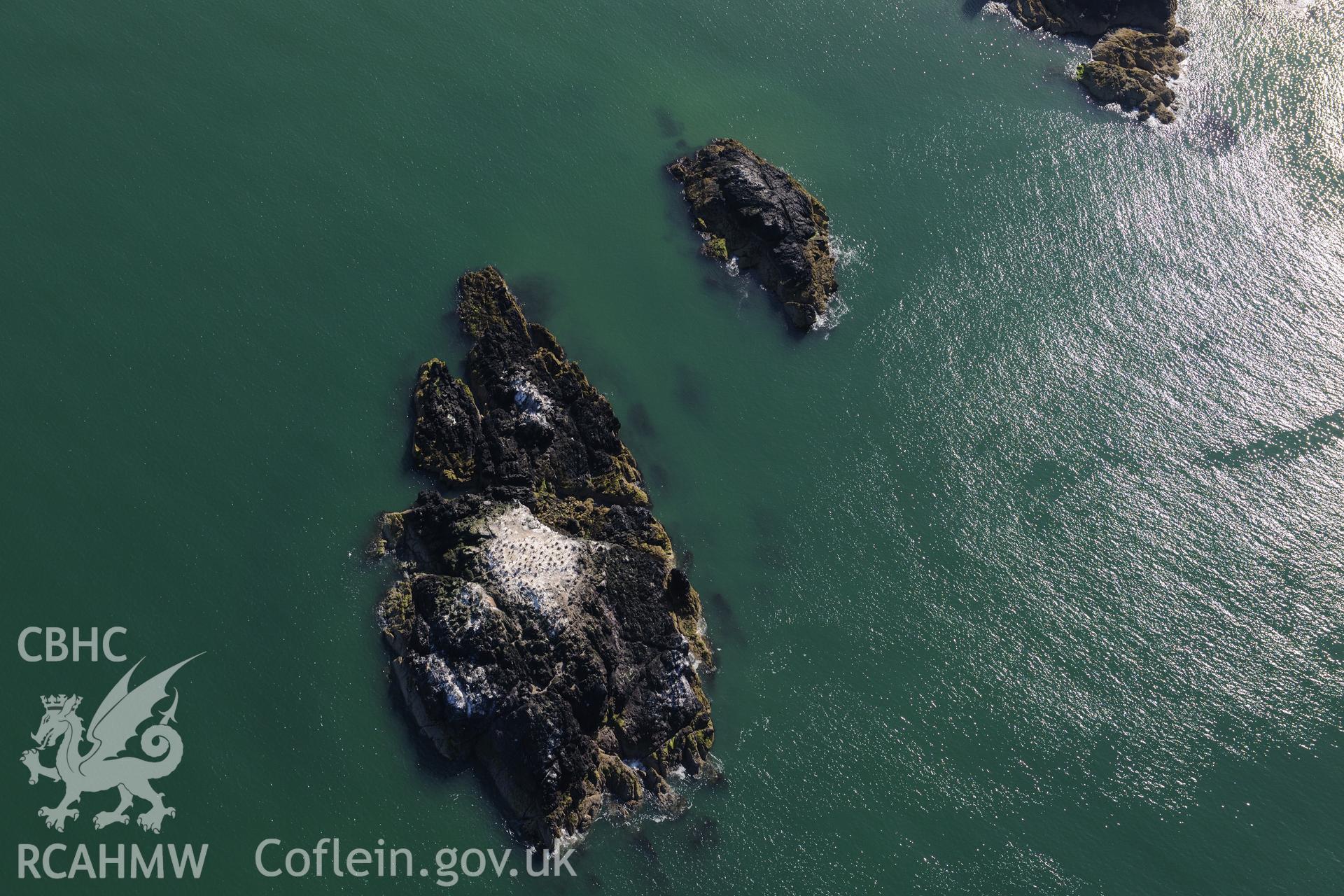 Ynys yr Adar, off the coast of Llanddwyn Island. Oblique aerial photograph taken during the Royal Commission's programme of archaeological aerial reconnaissance by Toby Driver on 23rd June 2015.