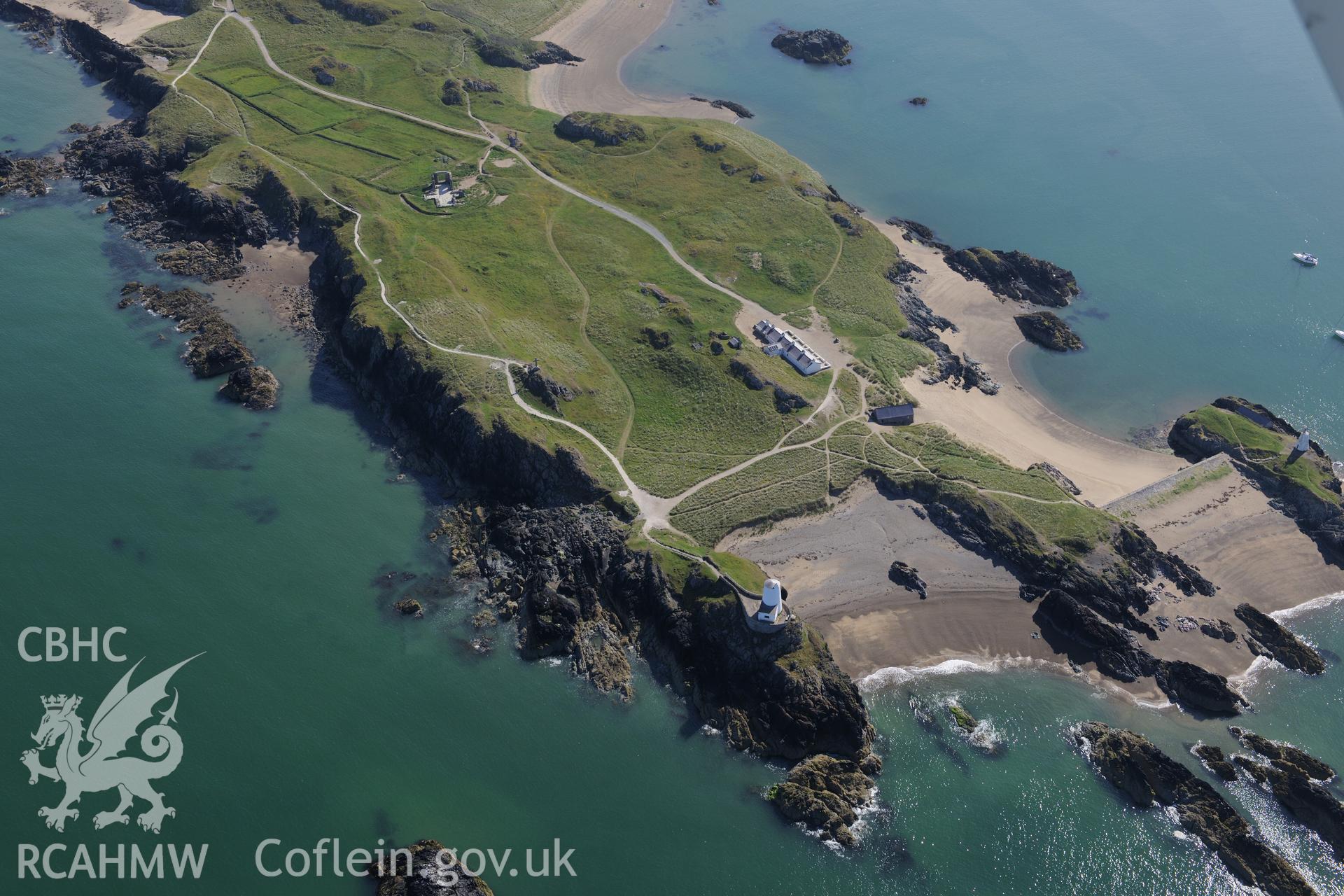 The lighthouse, tower, pilot's house and St. Dwynwen's Church on Llanddwyn Island. Oblique aerial photograph taken during the Royal Commission's programme of archaeological aerial reconnaissance by Toby Driver on 23rd June 2015.