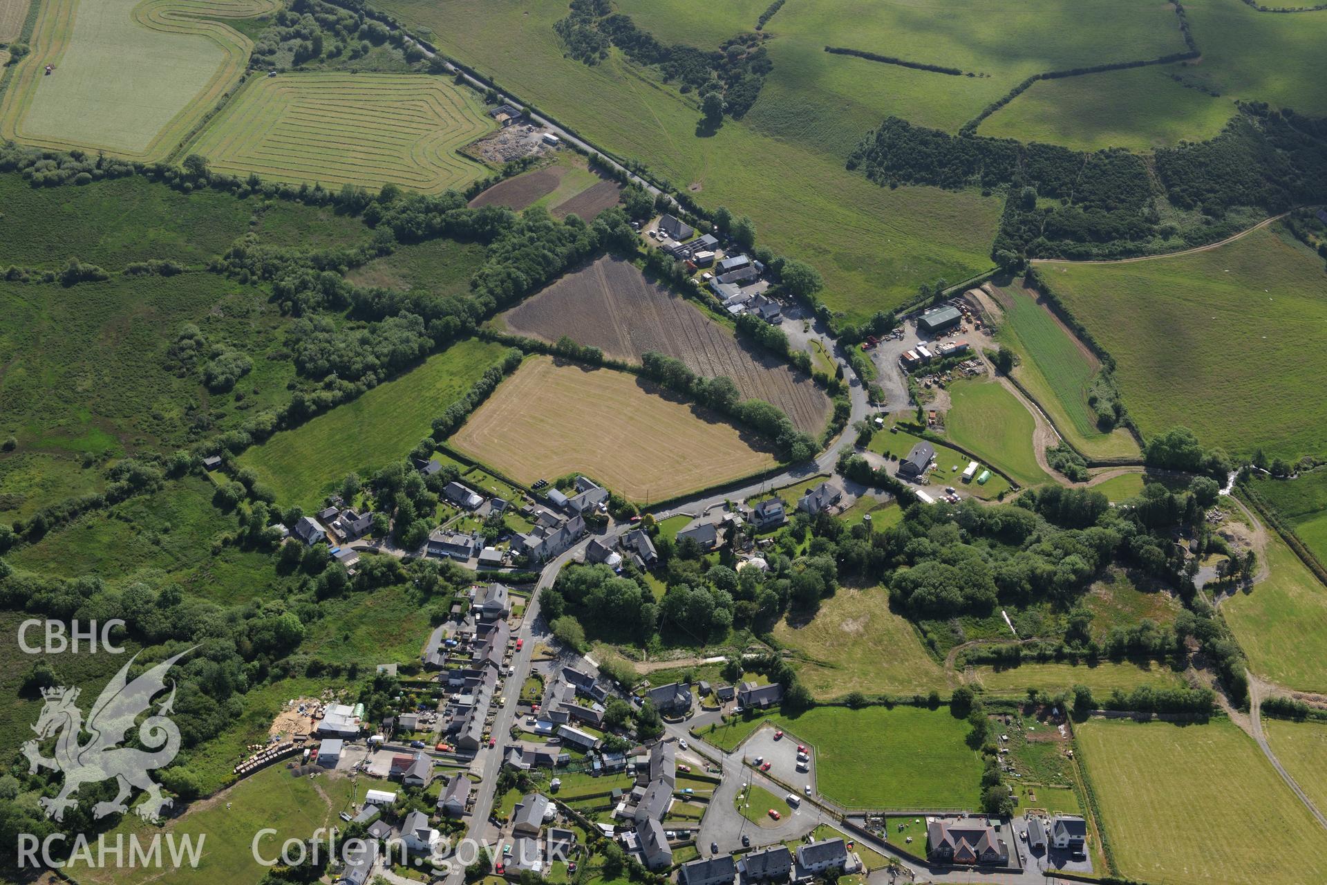 The village of Rhyd-y-Clafdu with the village school visible at the bottom right of the image. Oblique aerial photograph taken during the Royal Commission's programme of archaeological aerial reconnaissance by Toby Driver on 23rd June 2015.