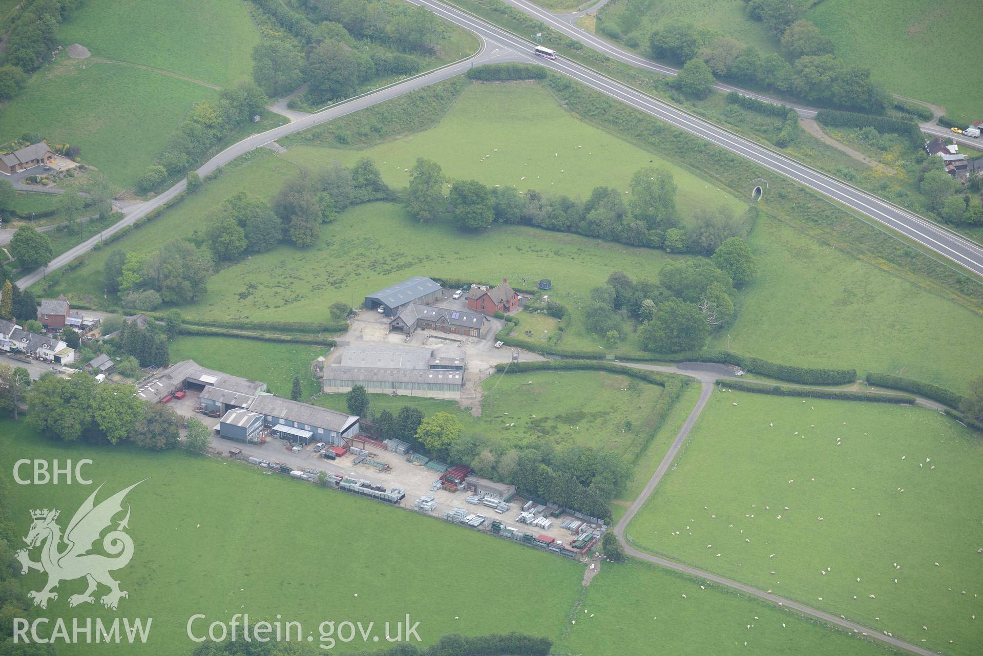 Cwrt Llechryd farm range, garden and defended enclosure or moat, Llanelwedd. Oblique aerial photograph taken during the Royal Commission's programme of archaeological aerial reconnaissance by Toby Driver on 11th June 2015.