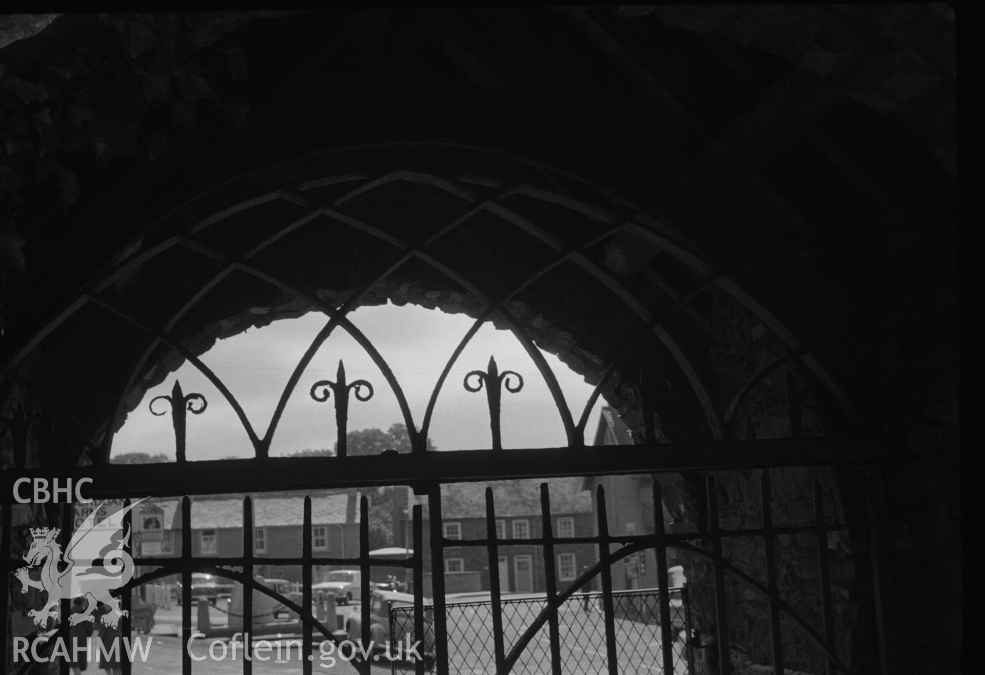 Digital copy of a black and white negative showing the ironwork (1814) of the east lychgate of St. Padarn's churchyard, Llanbadarn, Aberystwyth. (View looking west from Grid Reference SN 590 809). Photographed by Arthur O. Chater in August 1967.