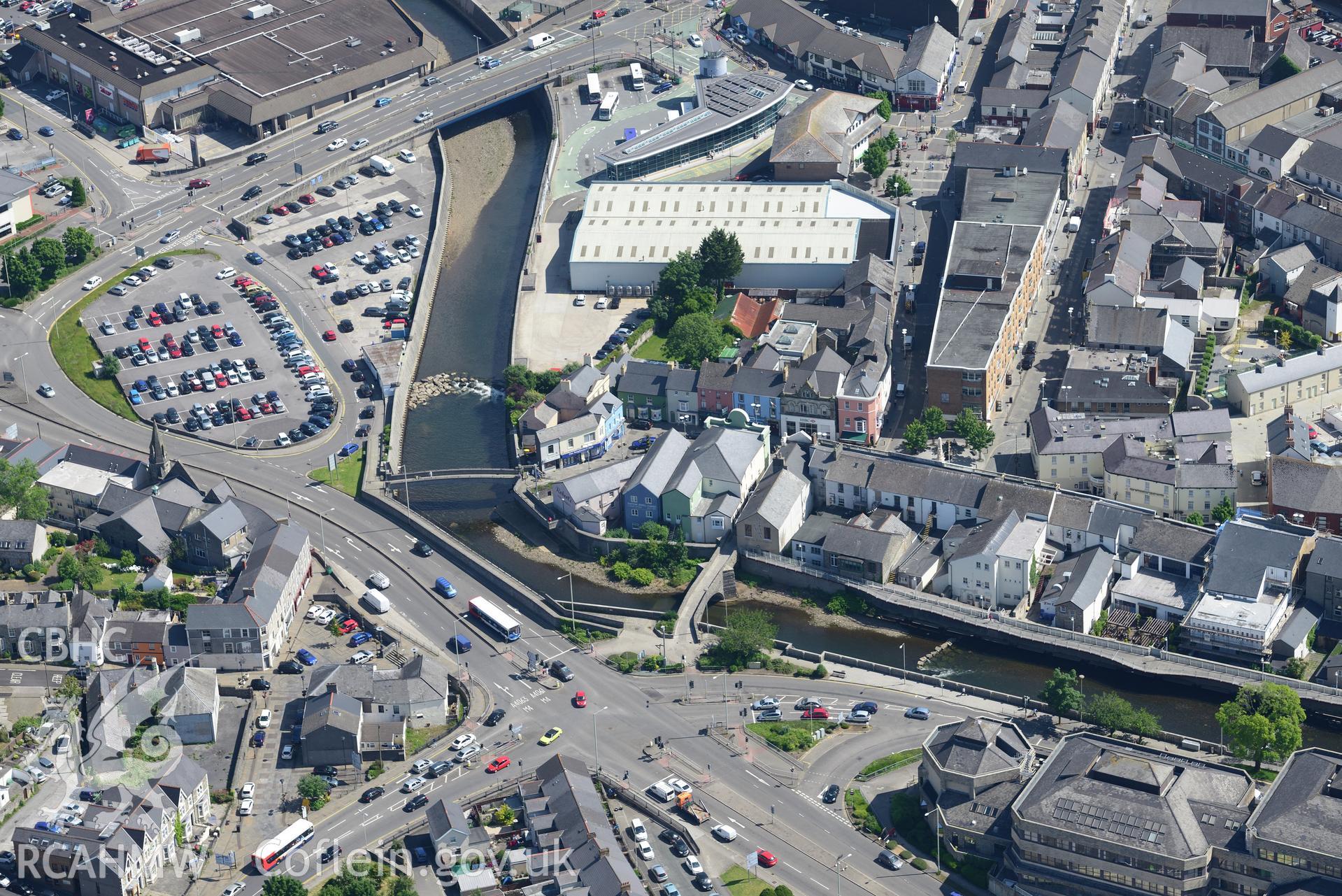The old bridge over the river Ogwr; Unitarian Chapel and County Borough Council Civic Offices, Bridgend. Oblique aerial photograph taken during the Royal Commission's programme of archaeological aerial reconnaissance by Toby Driver on 19th June 2015.