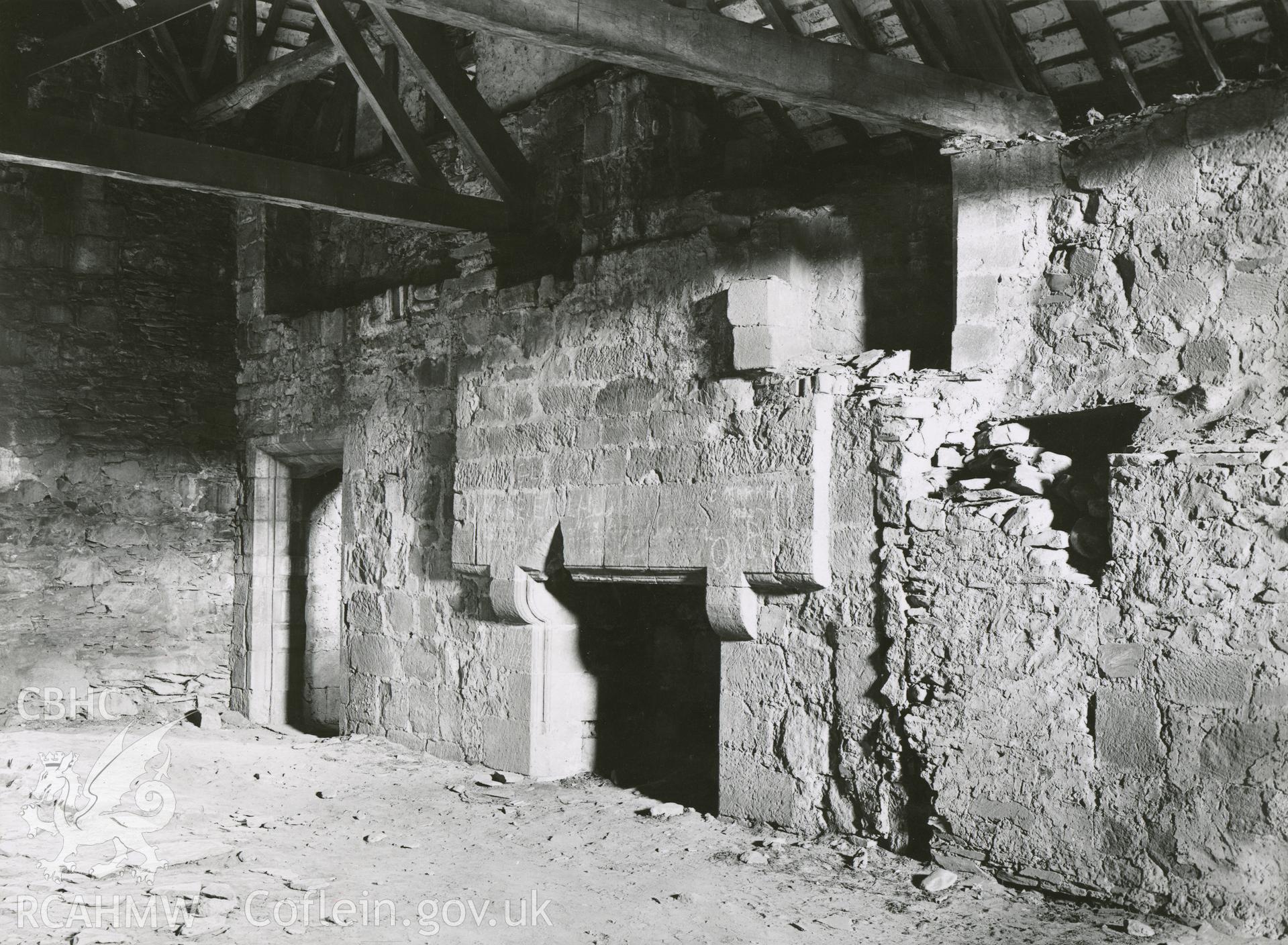 Digitised copy of a black and white photograph showing dormitory fireplace at Valle Crucis Abbey, taken by F.H. Crossley, 1949. Copied from print as negative held by NMR England (Historic England).