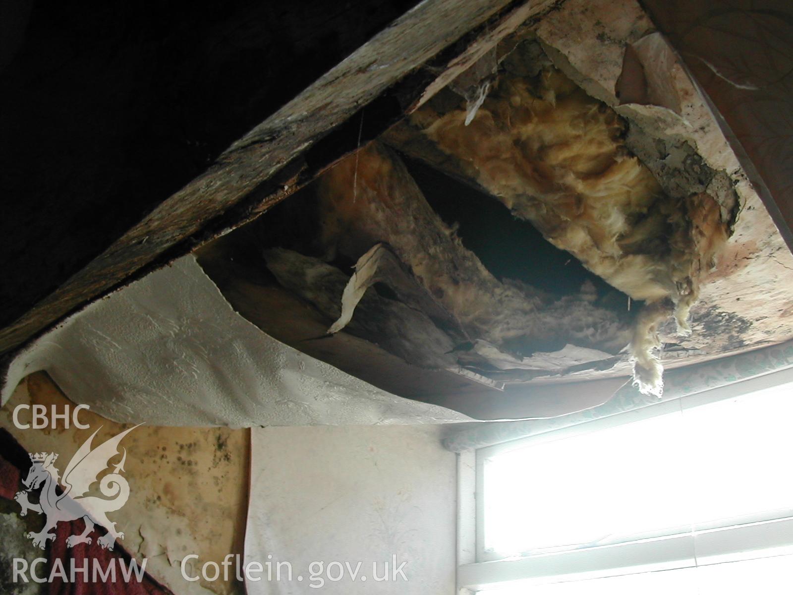 Colour photograph showing detailed interior view of damaged ceiling in Rosacre, Gronant, Prestatyn. Unknown date. Donated by the Conservation Department of Flintshire County Council, in advance of relocation to new offices.