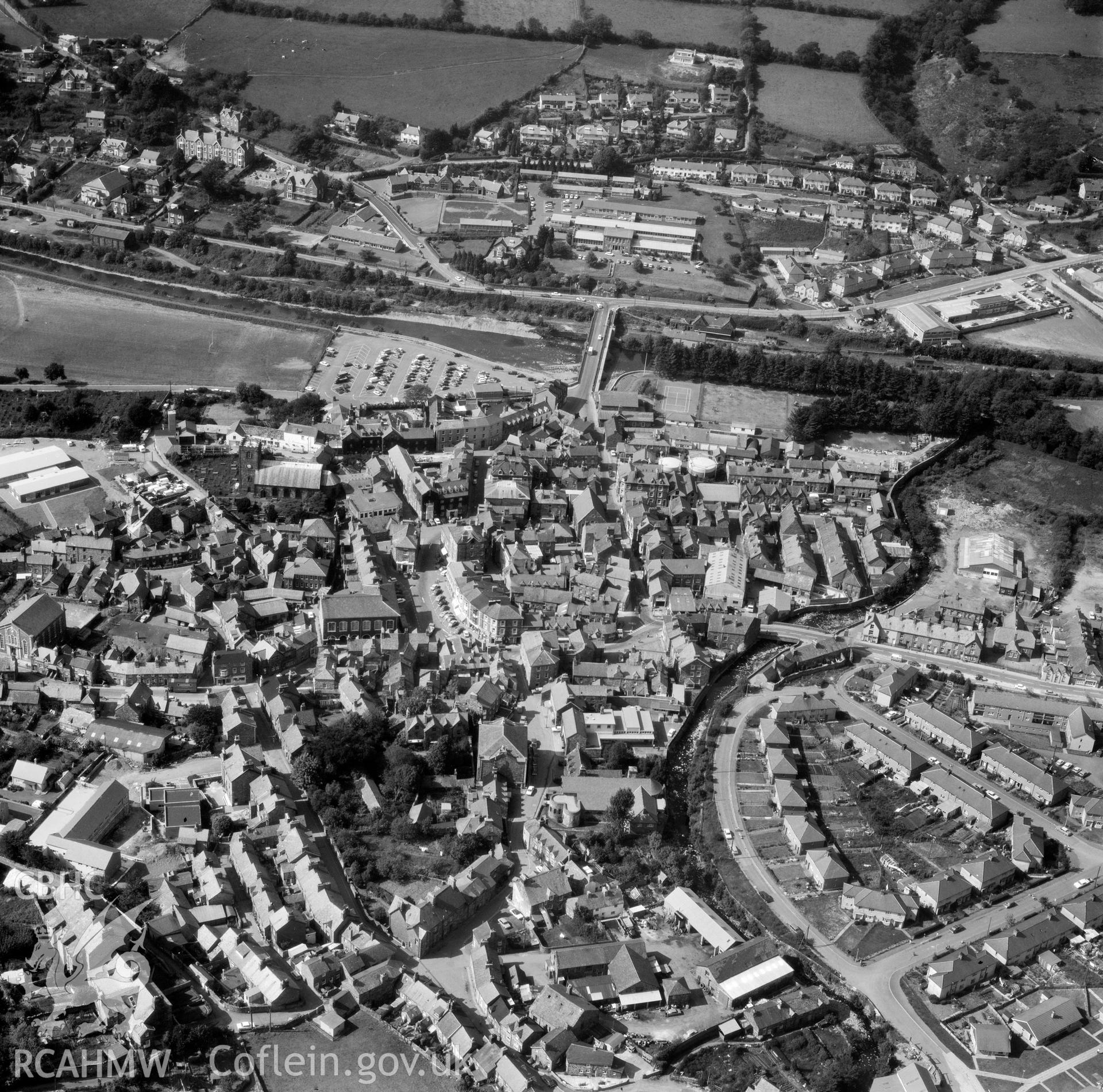 Black and white oblique aerial photograph showing Dolgellau, view of the town looking north, from Aerofilms album Merionethshire and Montgomeryshire, taken by Aerofilms Ltd and dated 1974.