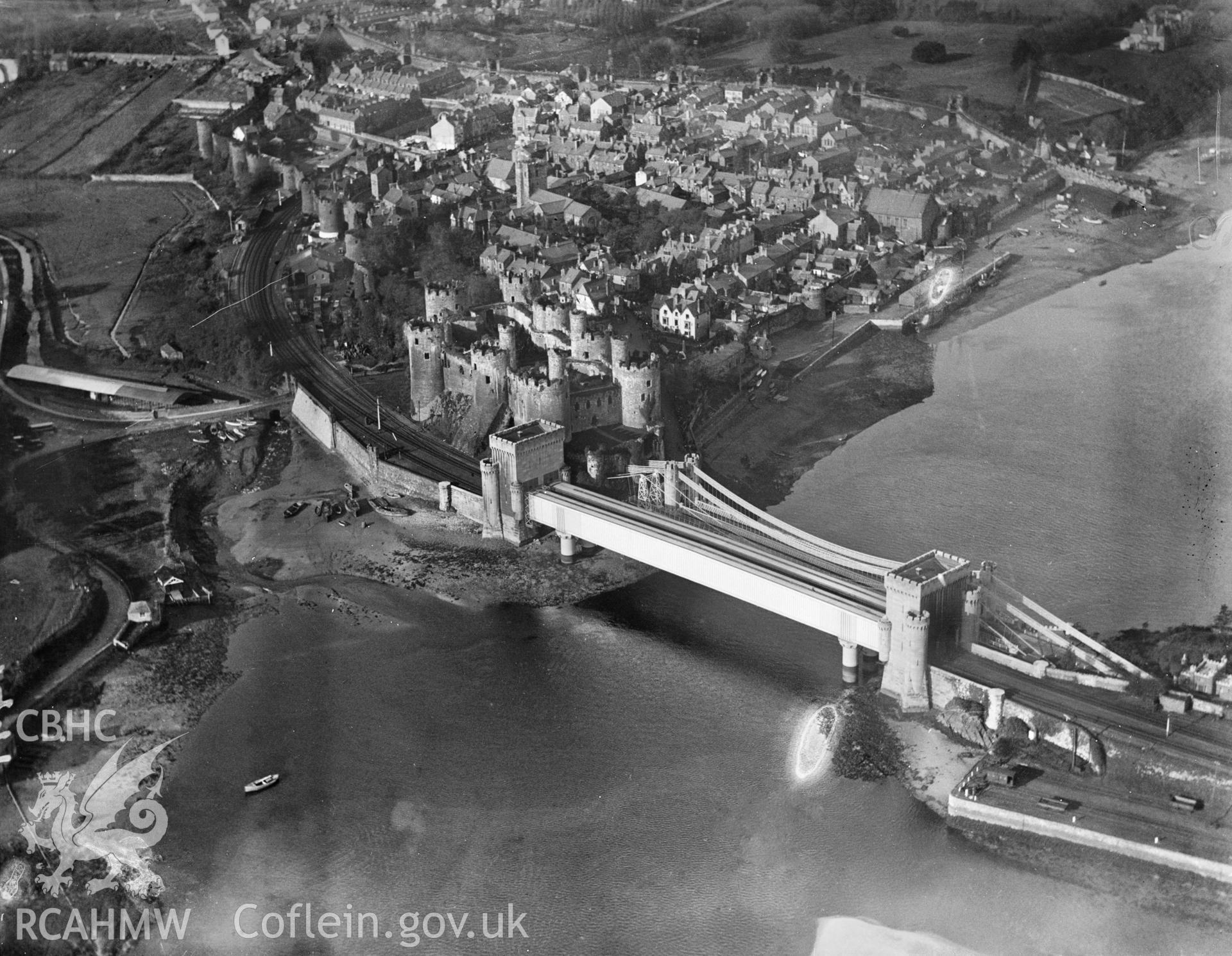 General view of Conwy showing castle and suspension bridge, oblique aerial view. 5?x4? black and white glass plate negative.