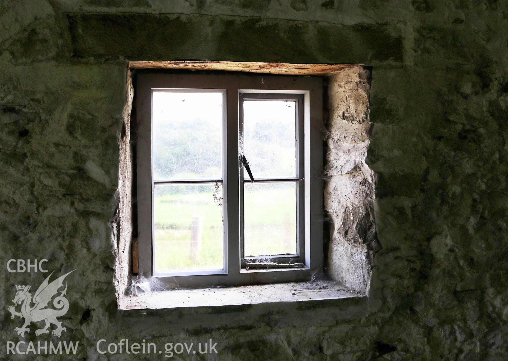 Photograph showing interior view of barn and cottage ground floor window at Maes yr Hendre, taken by Dr Marian Gwyn, 6th July 2016. (Original Reference no. 0086)