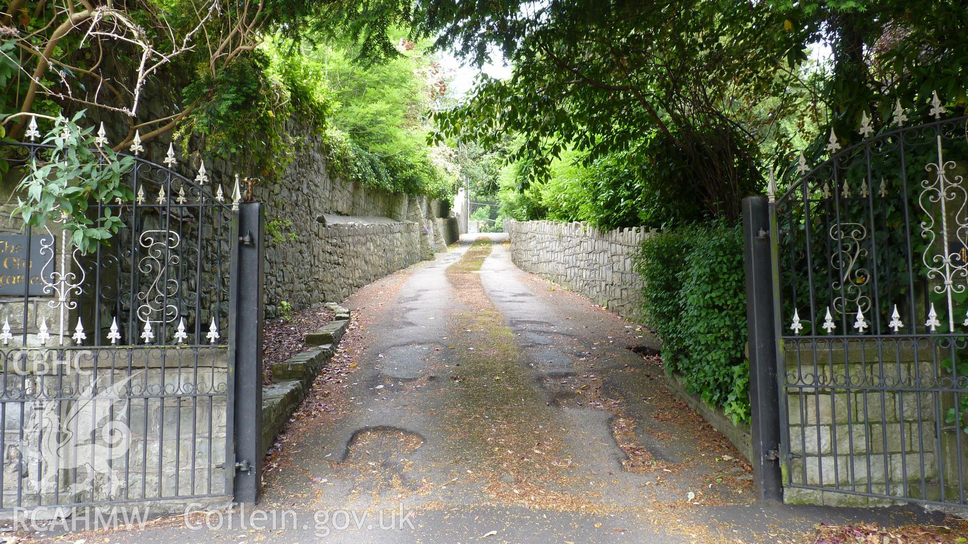 'Entrance to the coach house driveway from Park Street, now used as a drive to neighbouring private residence.' Photographed as part of archaeological work at Coed Parc, Newcastle, Bridgend, carried out by Archaeology Wales, 2016. Project no. P2432.