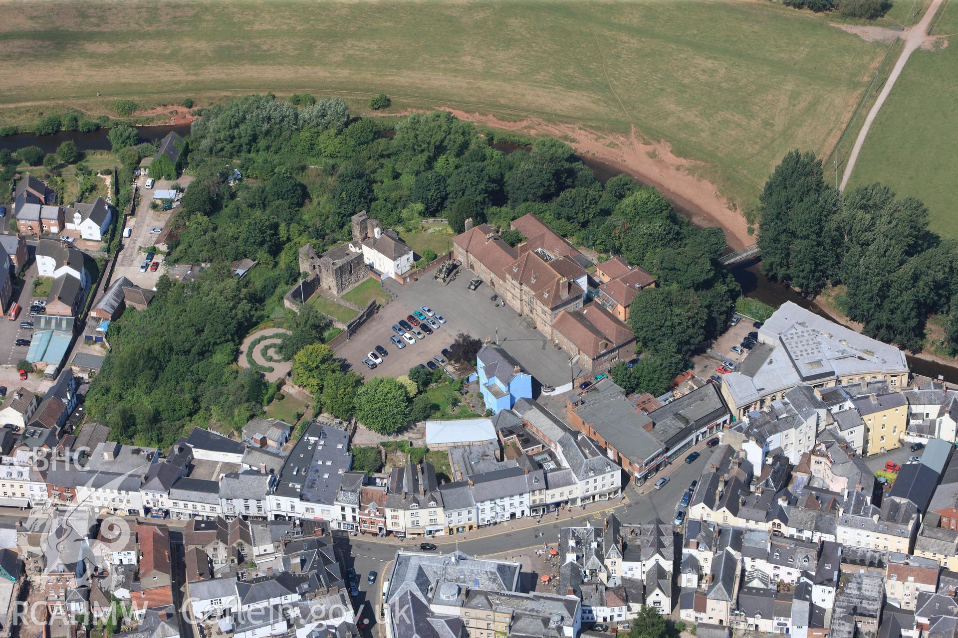 Great Castle House, Monmouth Castle, Market Hall and Town Hall, Monmouth. Oblique aerial photograph taken during the Royal Commission?s programme of archaeological aerial reconnaissance by Toby Driver on 1st August 2013.