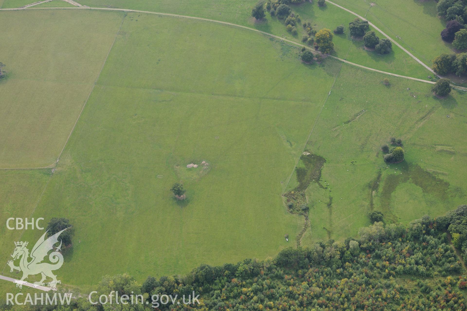 St. George's well and First World War practise trenches at Kinmel Park. Oblique aerial photograph taken during the Royal Commission's programme of archaeological aerial reconnaissance by Toby Driver on 11th September 2015.