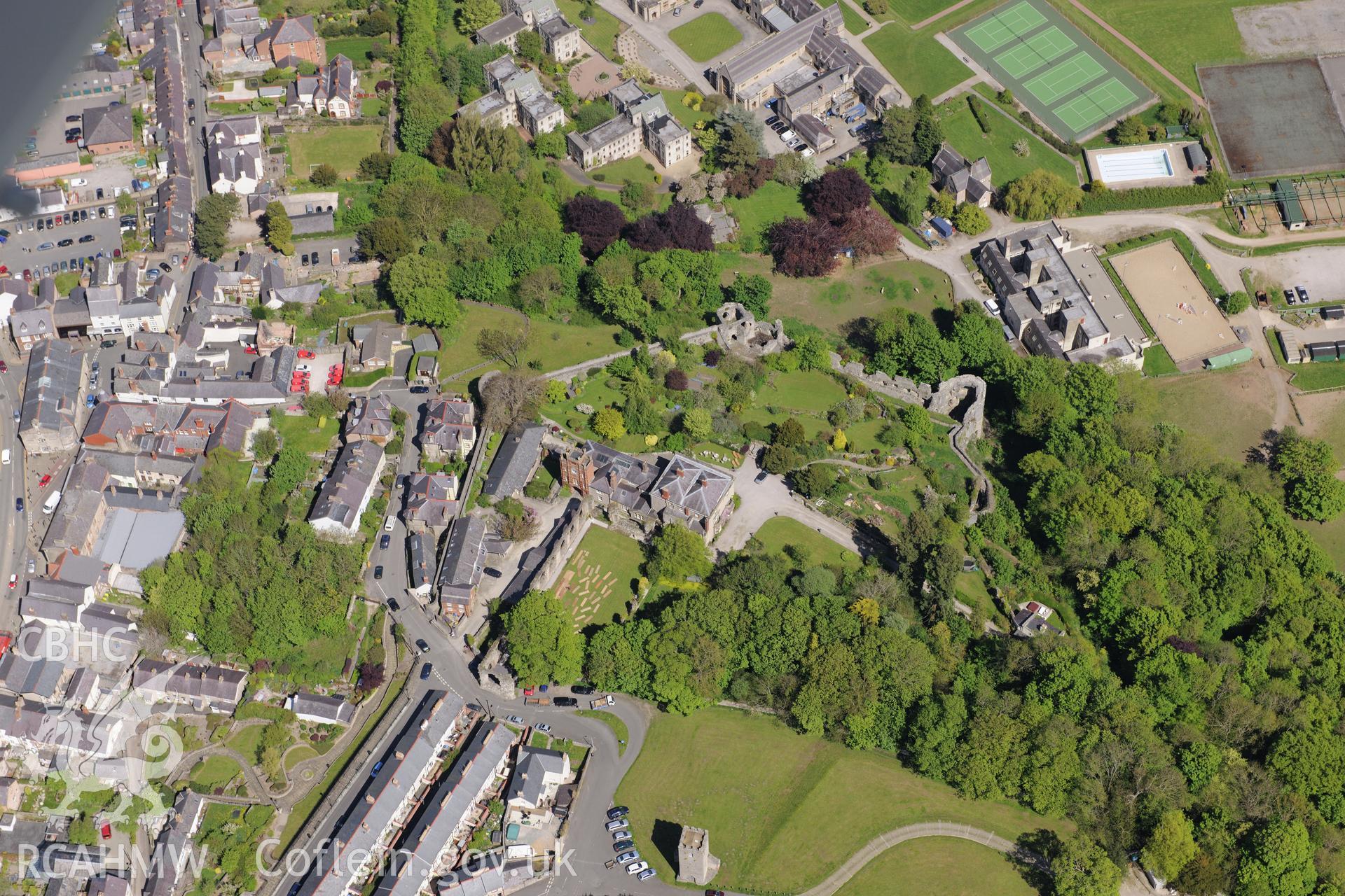 Denbigh town wall, Goblin Tower, St. David's church, Castle House and Howell's School, Denbigh. Oblique aerial photograph taken during the Royal Commission?s programme of archaeological aerial reconnaissance by Toby Driver on 22nd May 2013.