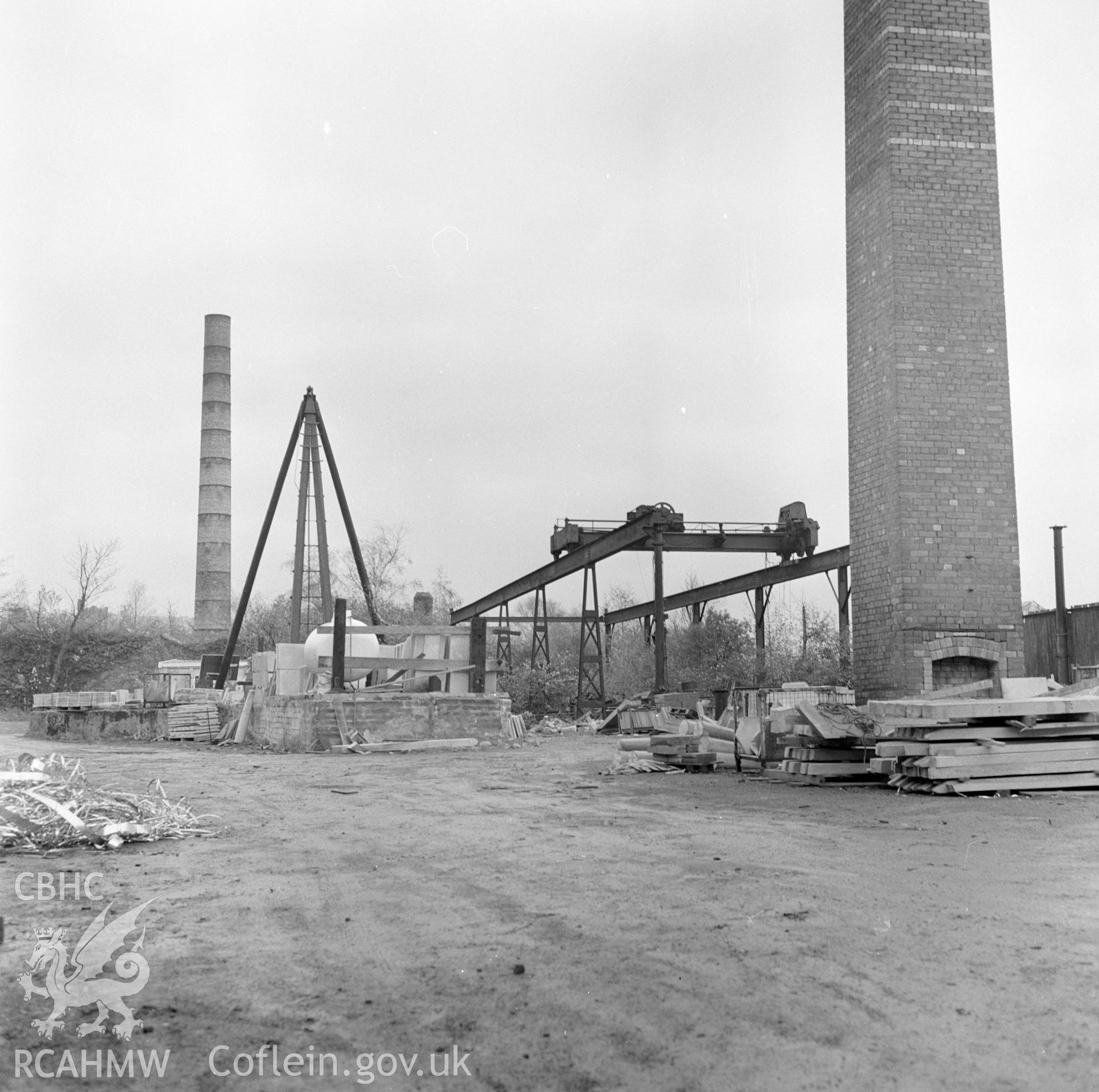 Digital copy of a black and white negative showing exterior view of the building housing the crane at Player's Works Foundry, Clydach, taken by RCAHMW, undated.