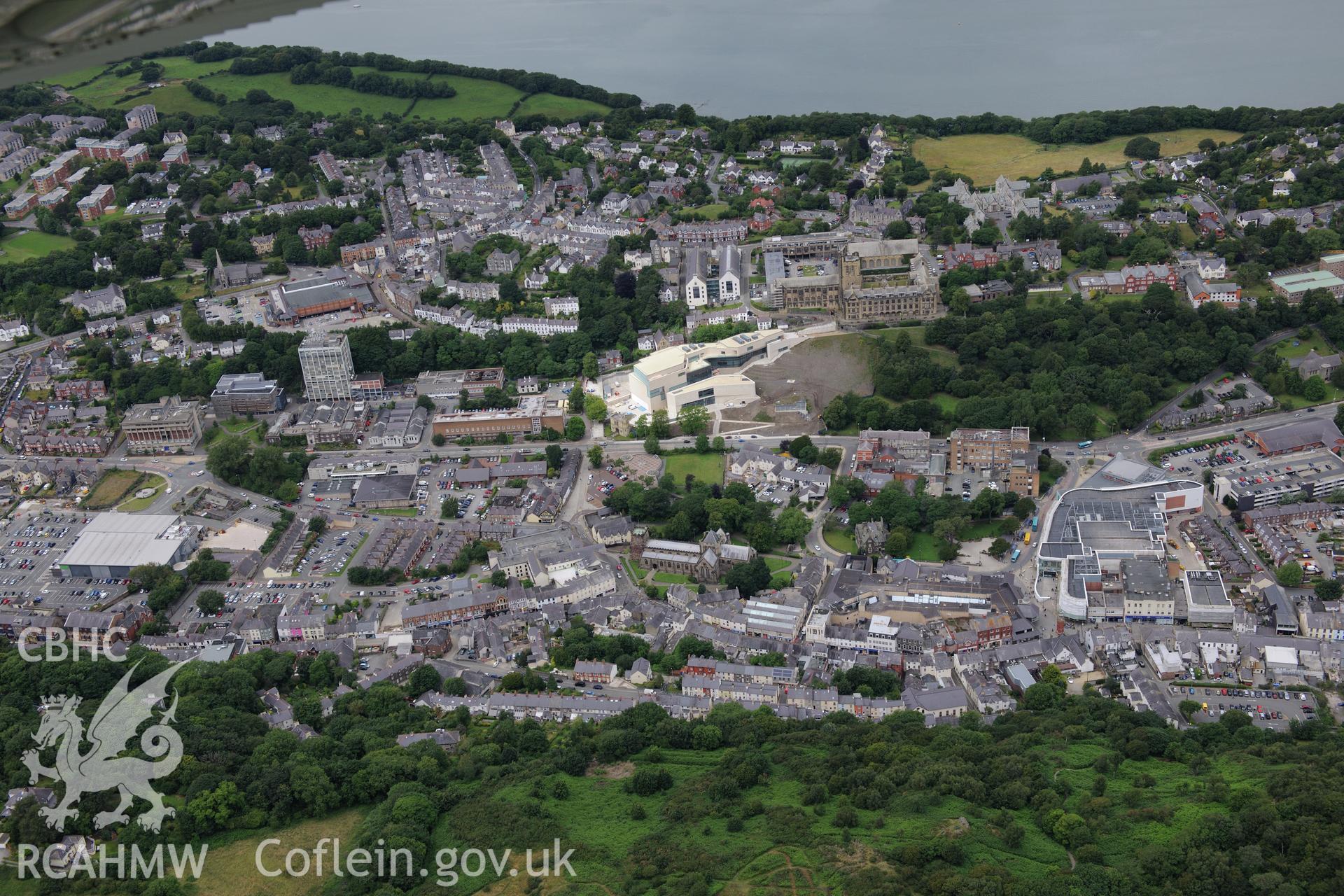 Bangor Cathedral, University, Theatr Gwynedd(demolished),Pontio, medieval church site,Catholic church & museum. Oblique aerial photograph taken during the Royal Commission's programme of archaeological aerial reconnaissance by Toby Driver on 30th July 2015.