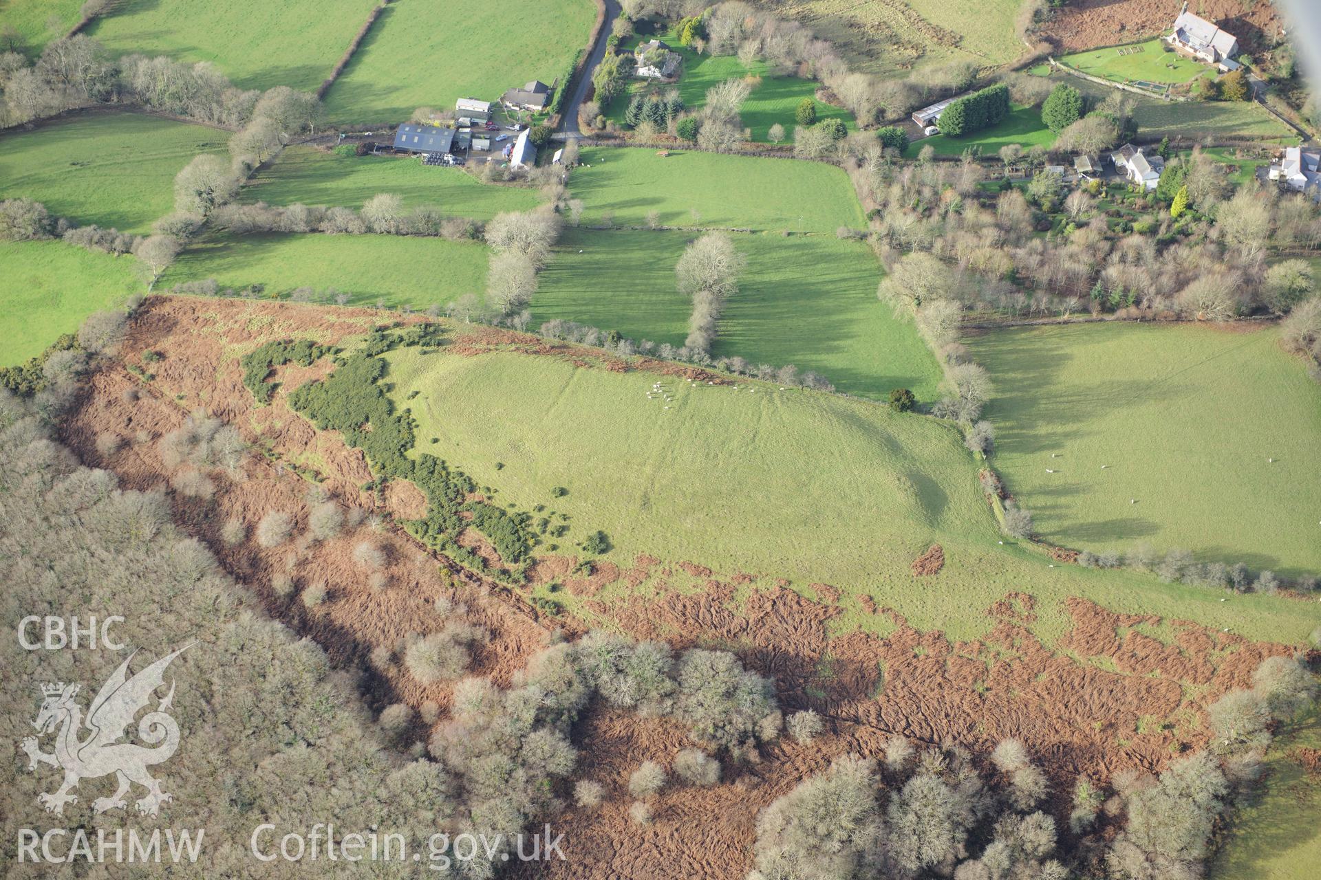 Pen-y-Gaer farm cottage and defended enclosure. Oblique aerial photograph taken during the Royal Commission's programme of archaeological aerial reconnaissance by Toby Driver on 6th January 2015.