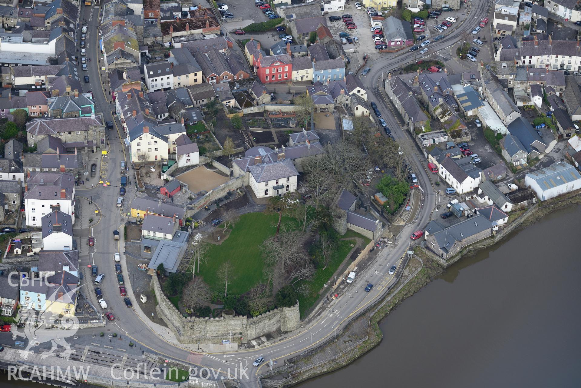Cardigan Castle and the associated house and garden, plus the Old Shire Hall, Cardigan. Oblique aerial photograph taken during the Royal Commission's programme of archaeological aerial reconnaissance by Toby Driver on 13th March 2015.