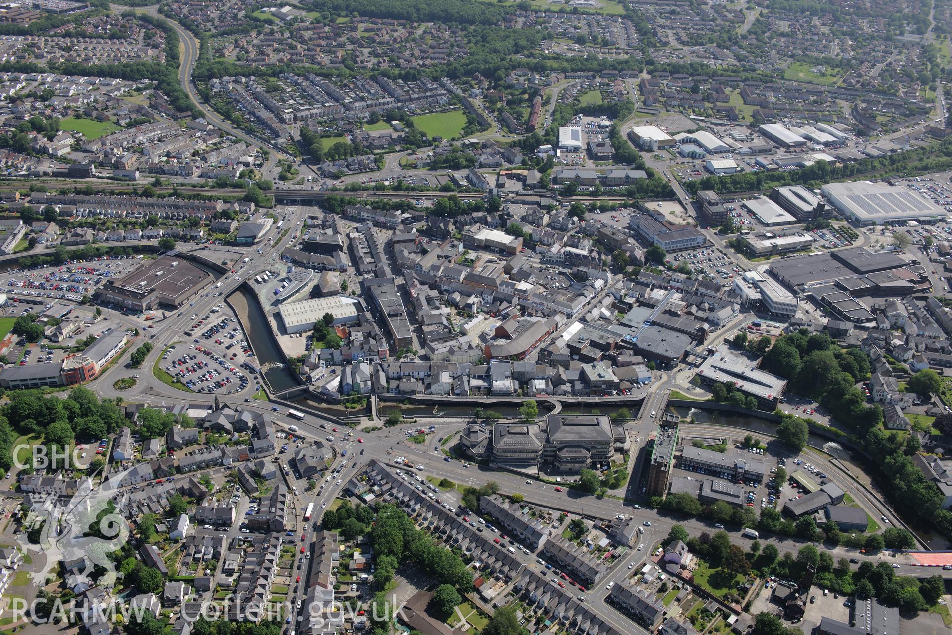 Bridgend town centre including view of Bridgend County Borough Council Civic Offices . Oblique aerial photograph taken during the Royal Commission's programme of archaeological aerial reconnaissance by Toby Driver on 19th June 2015.