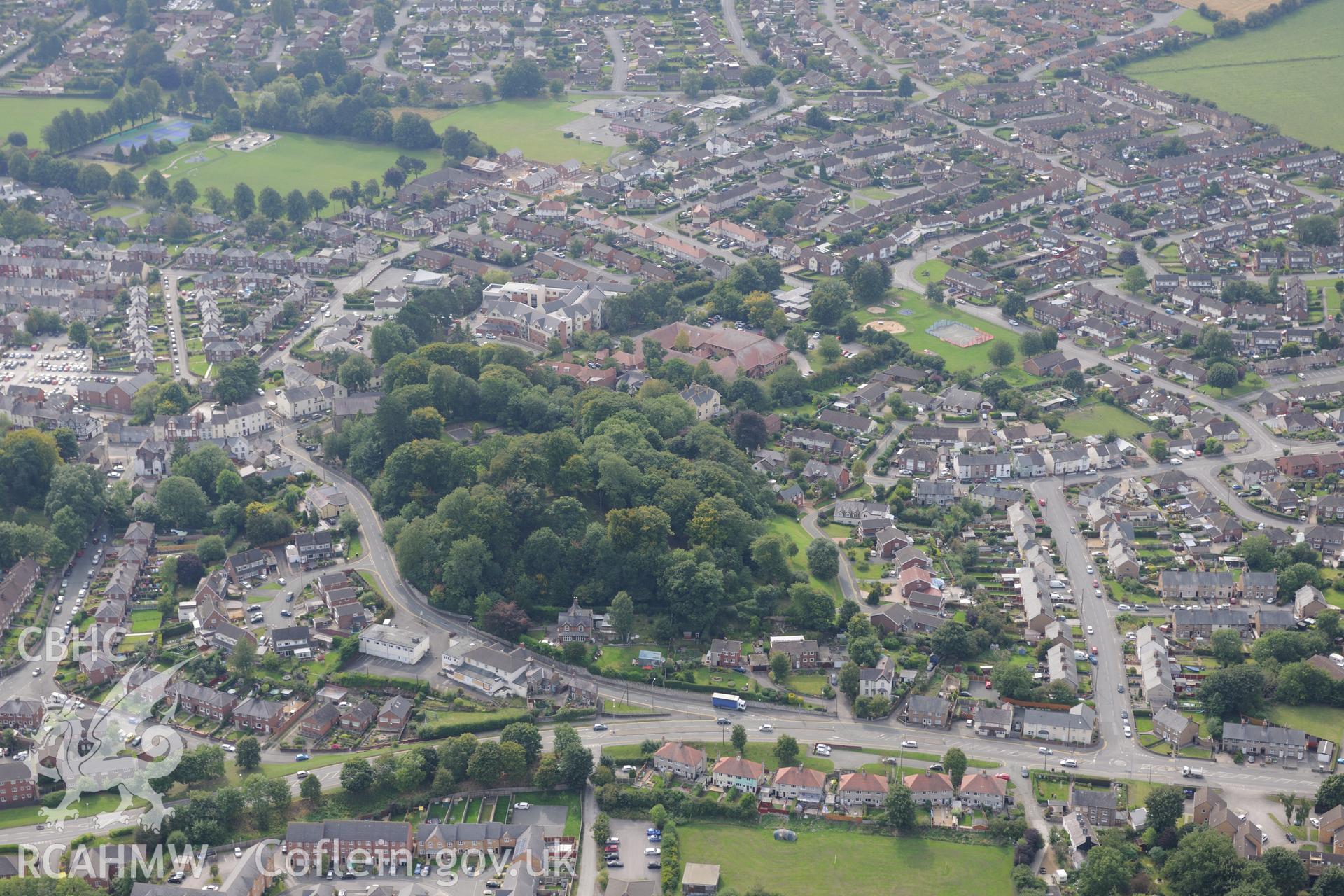 Mold castle and the surrounding town, Mold. Oblique aerial photograph taken during the Royal Commission's programme of archaeological aerial reconnaissance by Toby Driver on 11th September 2015.