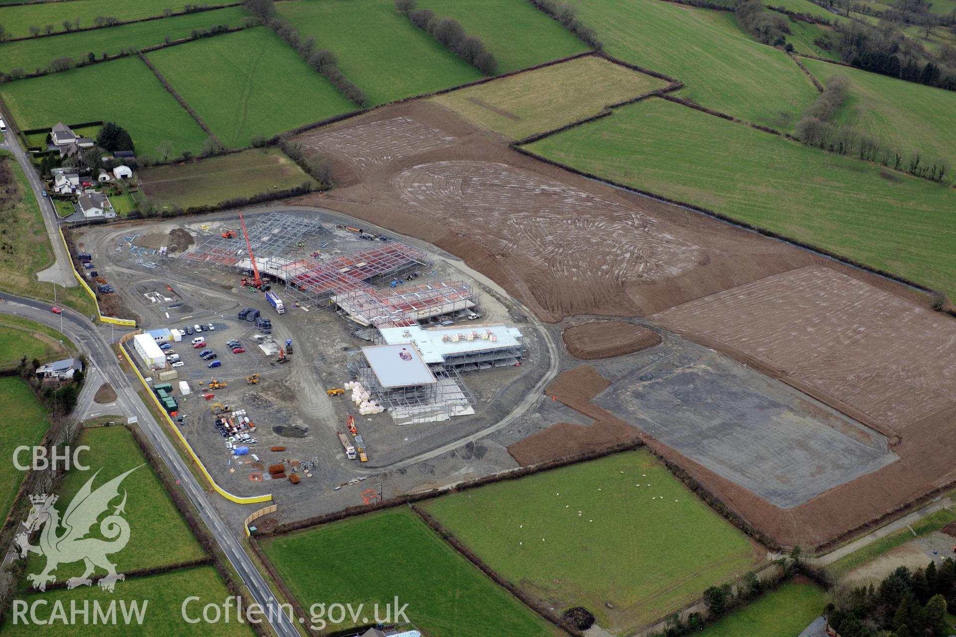 Ysgol Bro Teifi under construction on the northern outskirts of Llandysul. Oblique aerial photograph taken during the Royal Commission's programme of archaeological aerial reconnaissance by Toby Driver on 13th March 2015.