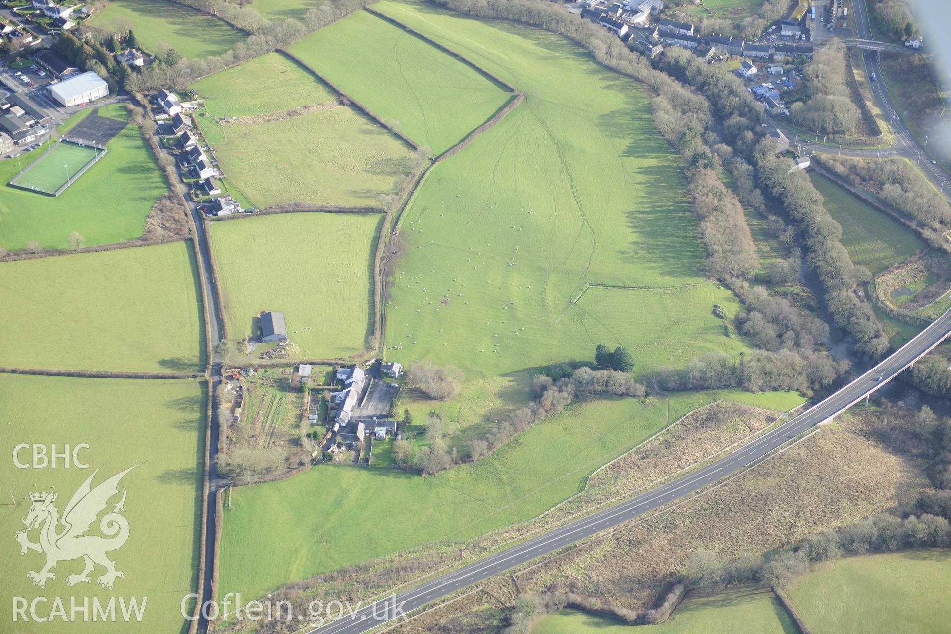 Views of Gilfachwen-Uchaf defended enclosure and earthworks, and Gilfachwen Mansion. Oblique aerial photograph taken during the Royal Commission's programme of archaeological aerial reconnaissance by Toby Driver on 6th January 2015.