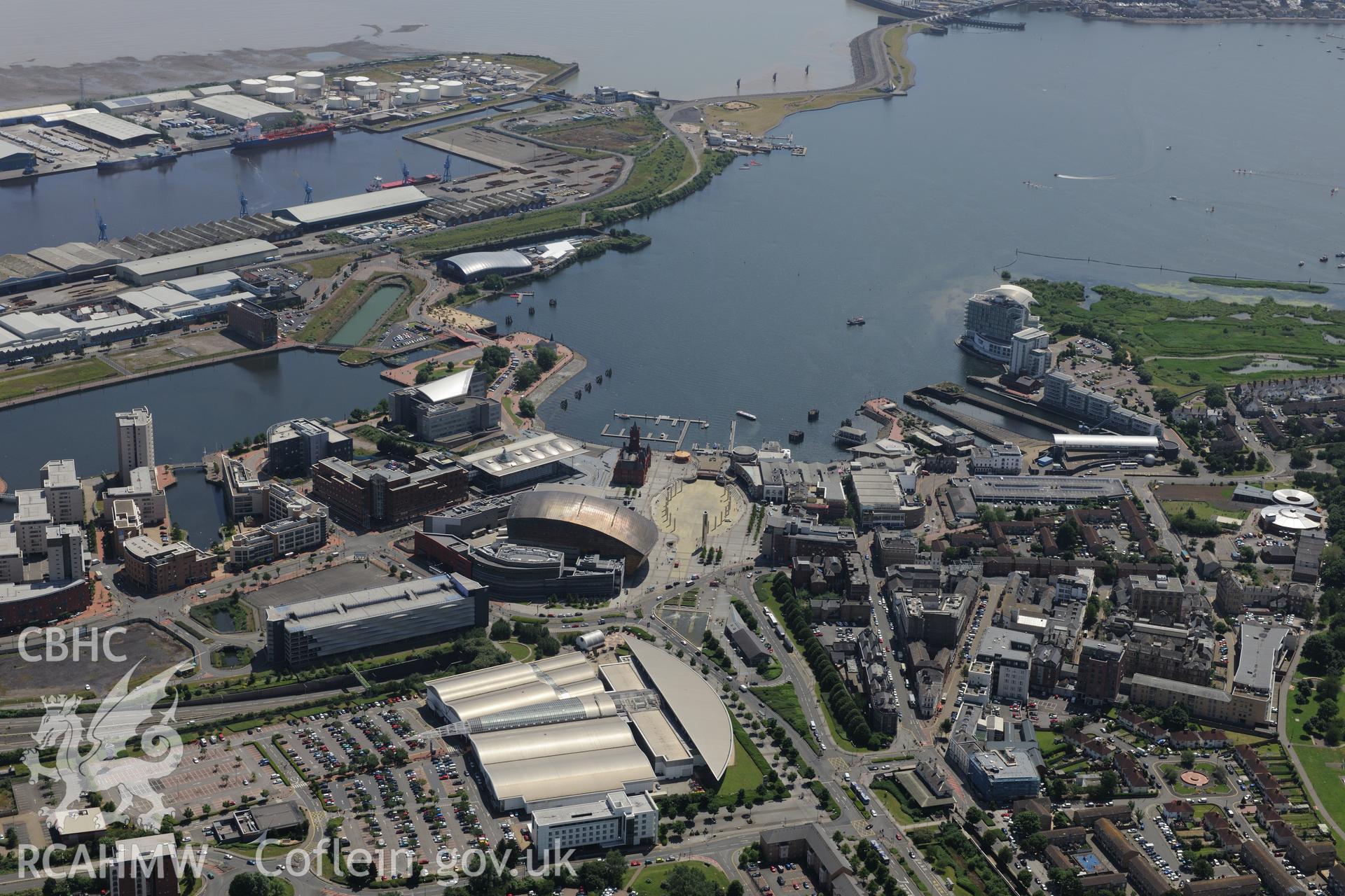 Pierhead Building; Senedd; Wales Millennium Centre; Red Dragon Centre; Queen Alexandra Dock & Roath Basin, Cardiff Bay.Oblique aerial photograph taken during Royal Commission?s programme of archaeological aerial reconnaissance by Toby Driver on 29/06/2015