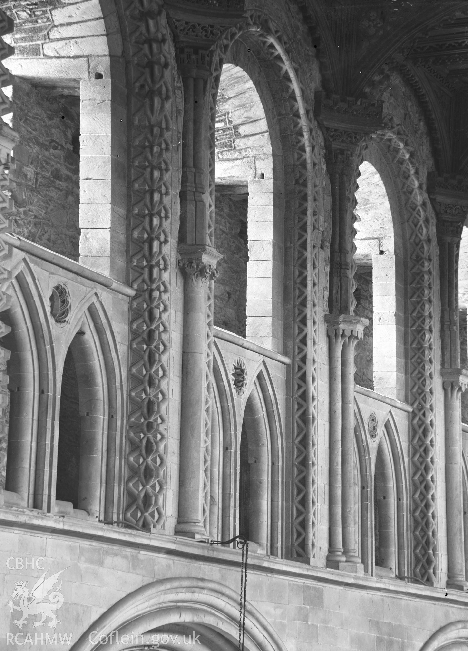 Digital copy of a black and white nitrate negative showing view of arches at St. David's Cathedral, taken by E.W. Lovegrove, July 1936.