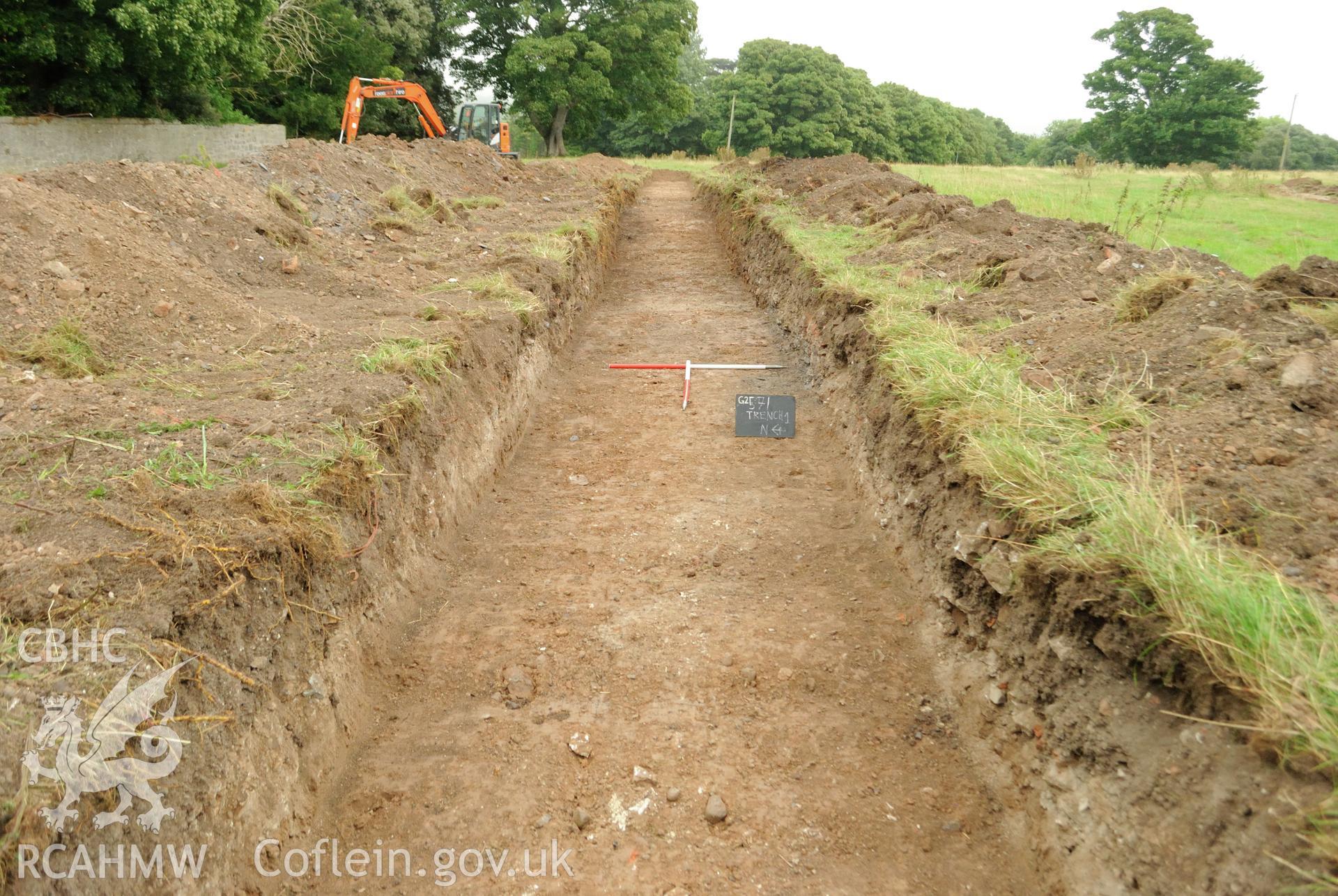 View from the west showing post excavation shot of trench 1; mid-point (western end). Photographed during archaeological evaluation of Kinmel Park, Abergele, conducted by Gwynedd Archaeological Trust on 22nd August 2018. Project no. 2571.